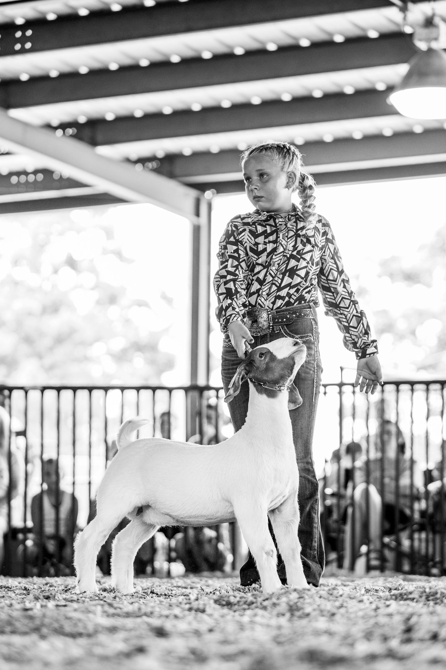 A young showman shows her goat at the Labette County Fair.