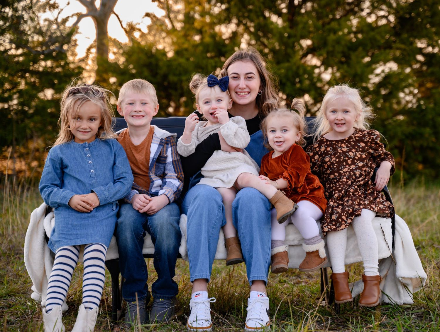 A family session in Bartlett, KS, during the fall weather at sunset.