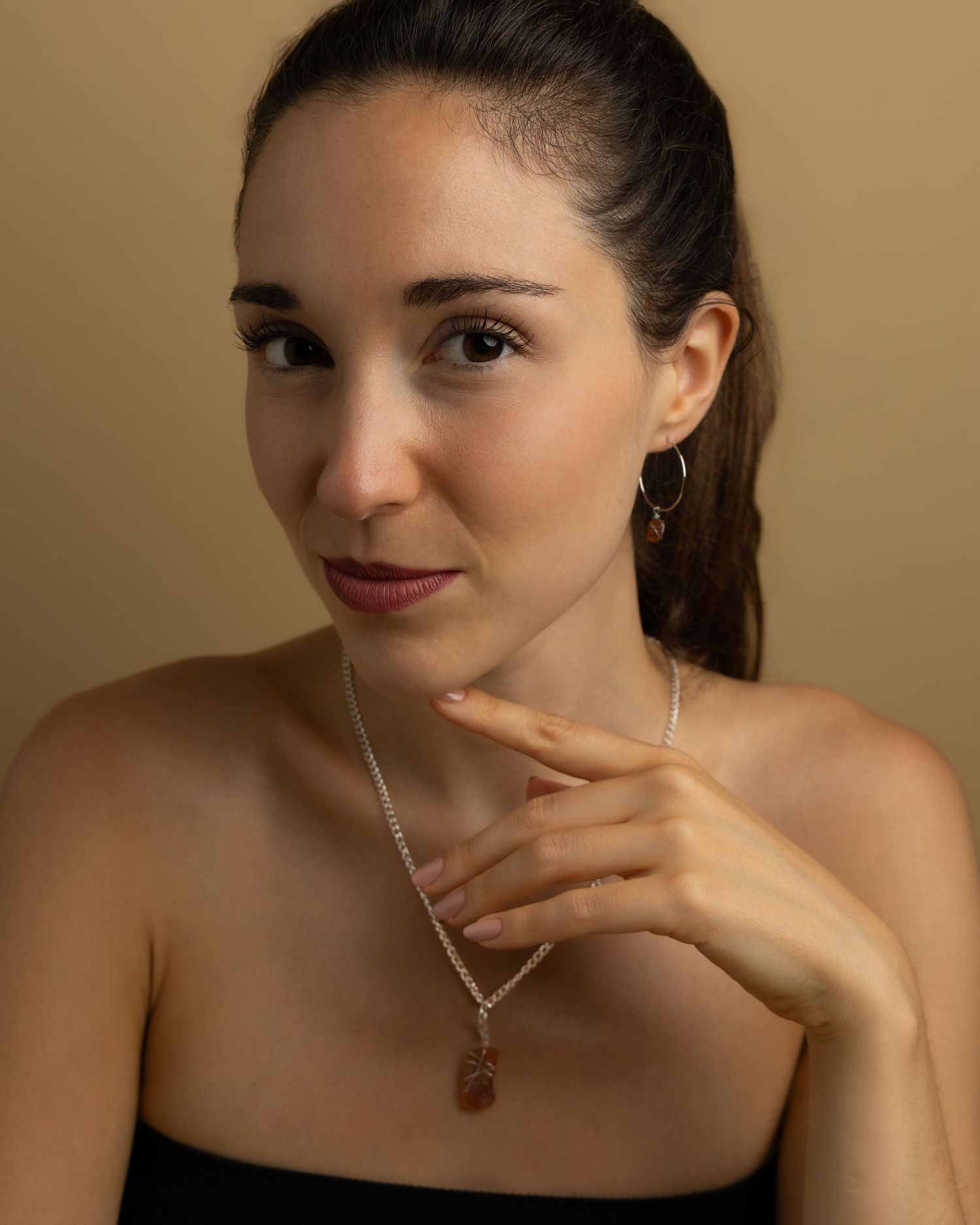 Portrait sequence showing artistic expressions and elegant poses with minimal styling against a neutral background.