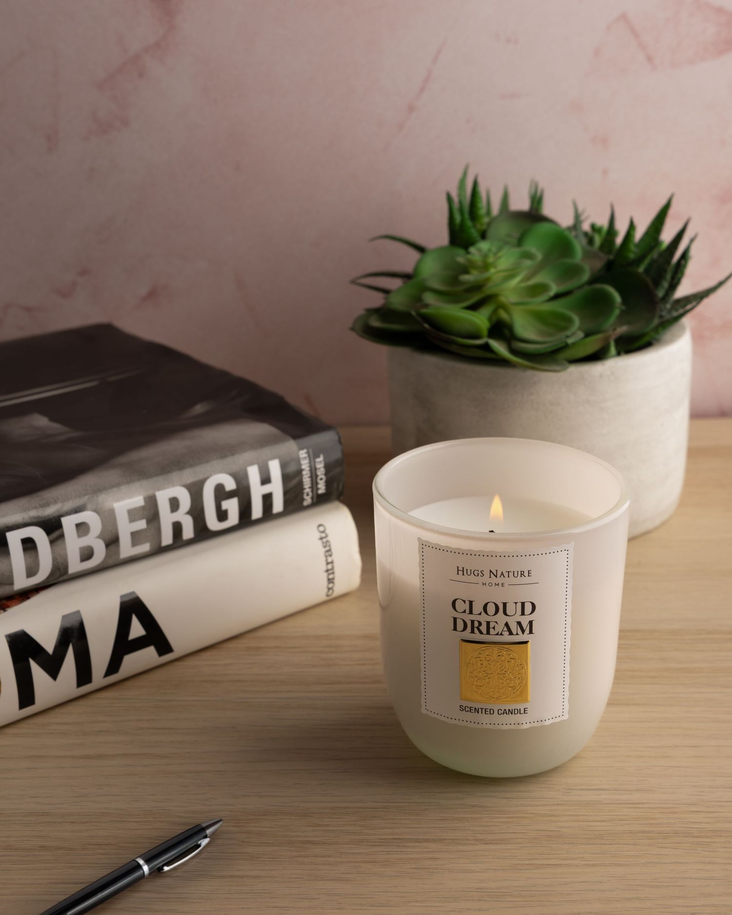 White ceramic candle holder with minimalist design and succulent plant displayed on wooden surface with natural lighting.