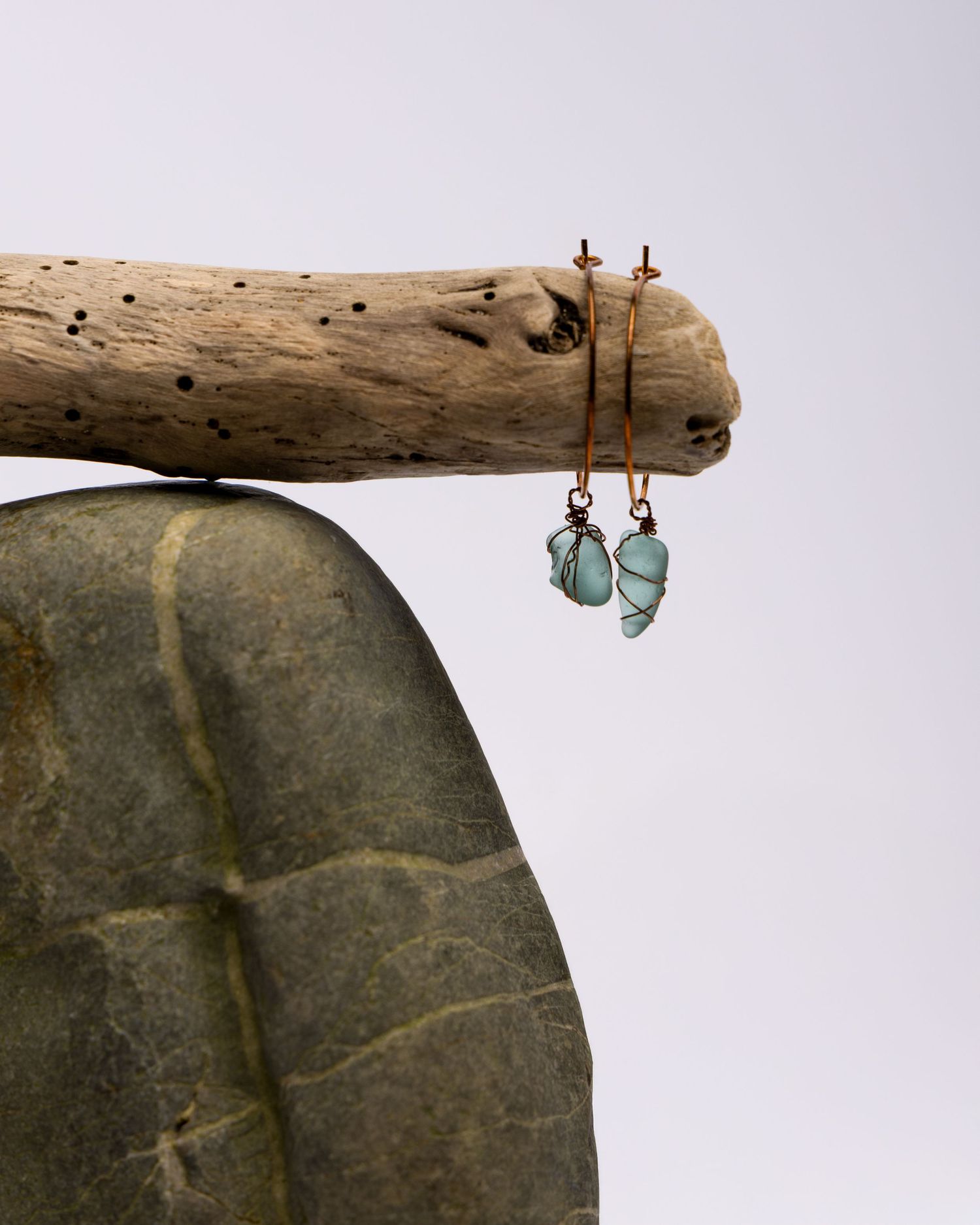 A collection of driftwood pieces photographed in a sequence showing textures and natural weathered patterns.