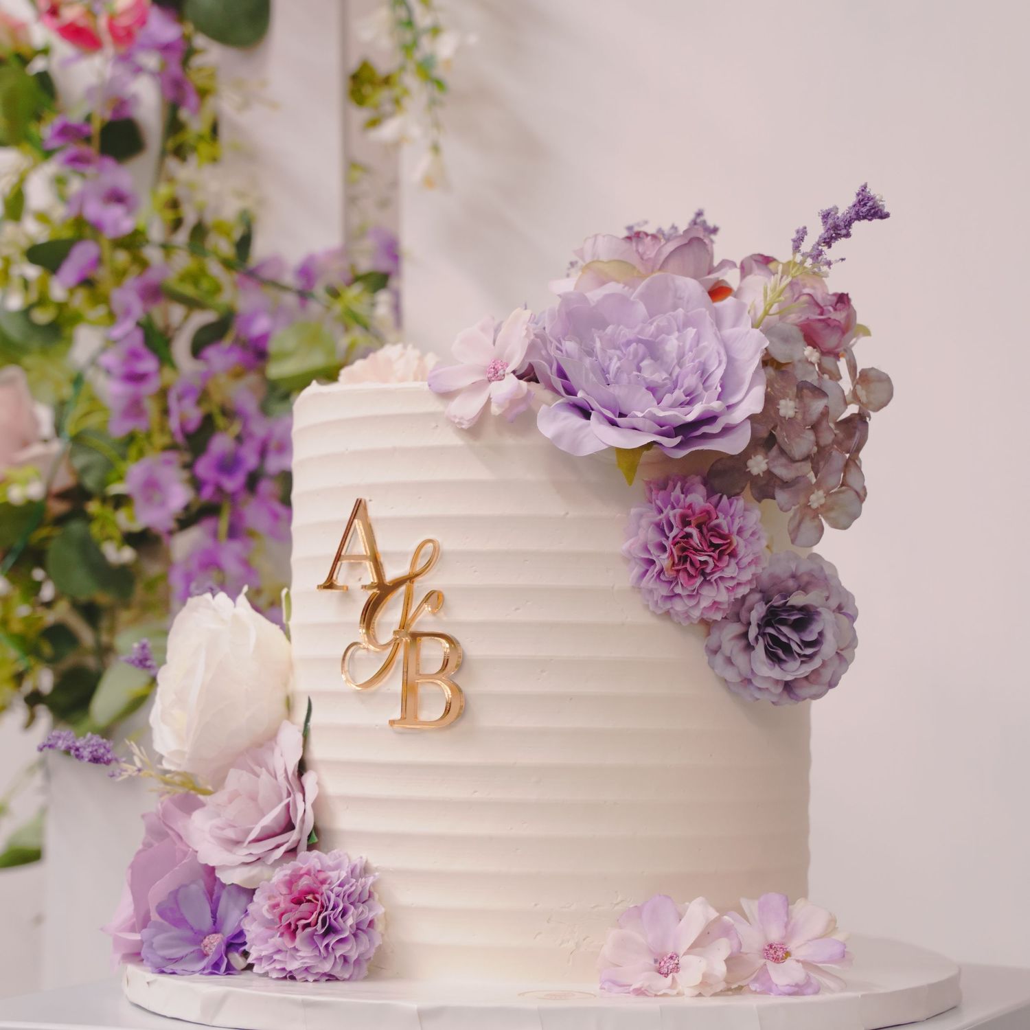 custom white cake with purple flowers. Tied in Time Photography.