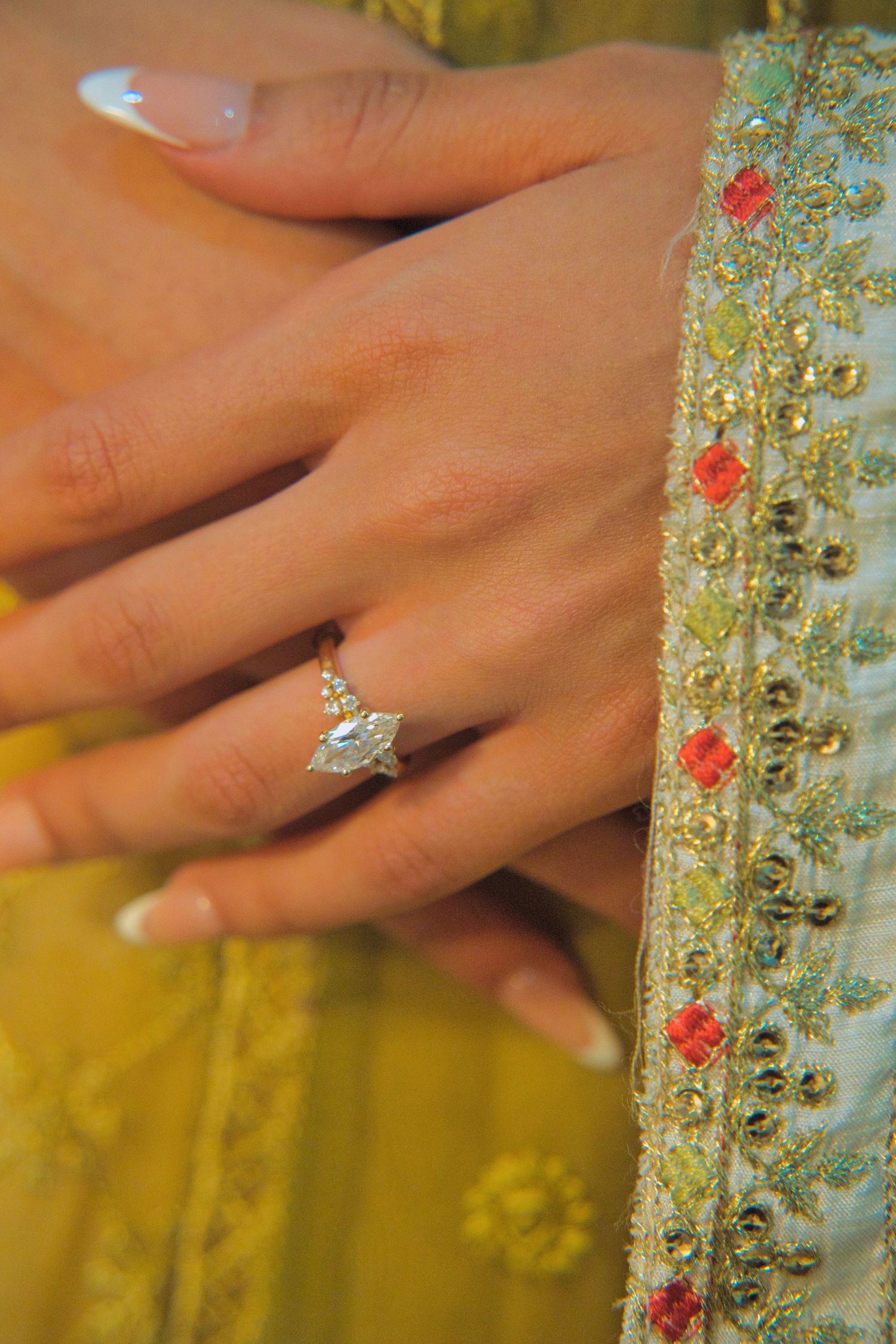 detail shot of brides hands with engagement ring, Tied in Time Photography.