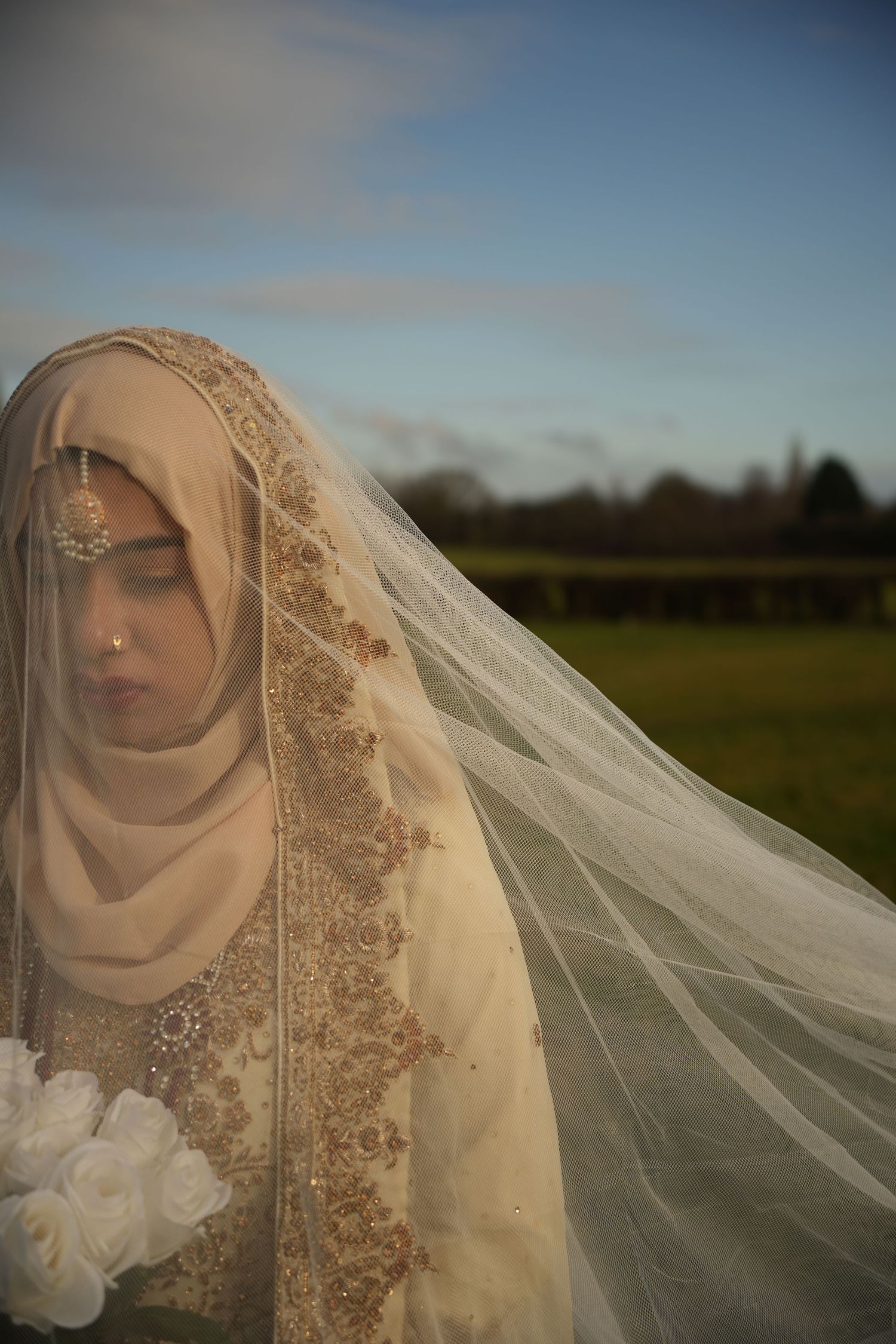 indian bride under flowing white veil. Tied in Time Photography.