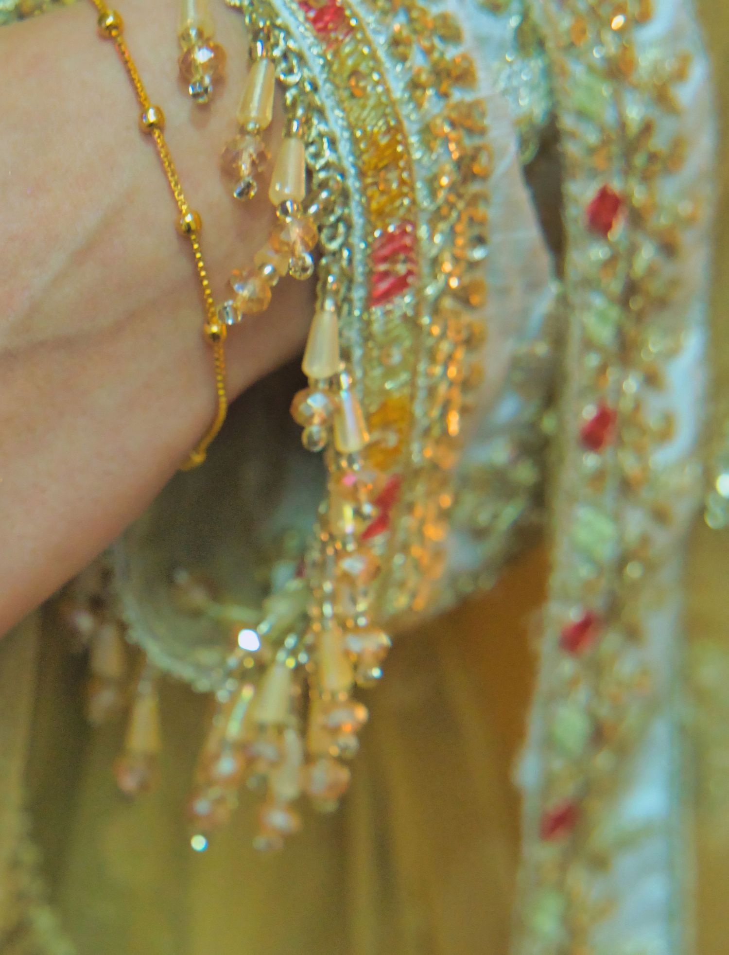 detailed shot of sleeve beadwork, Indian bridal. Tied in Time Photography.