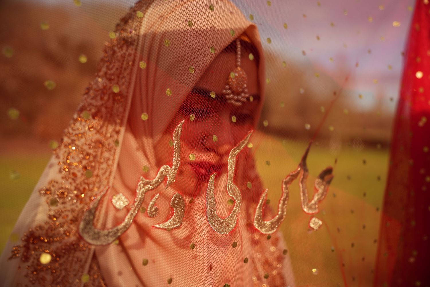 bride under red veil. Tied in Time Photography.