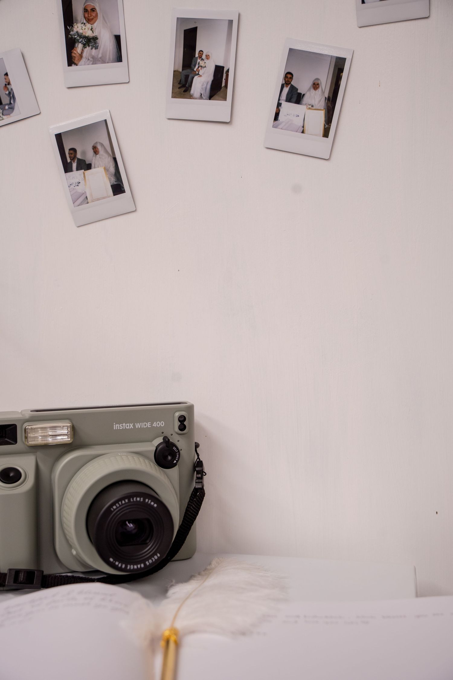 polaroid photos with polaroid camera, guestbook with feather pen. Tied in Time Photography.