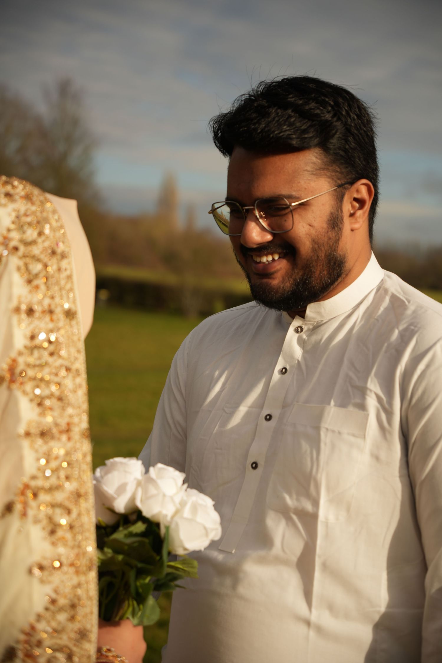 indian groom smiling at bride. Tied in Time Photography.