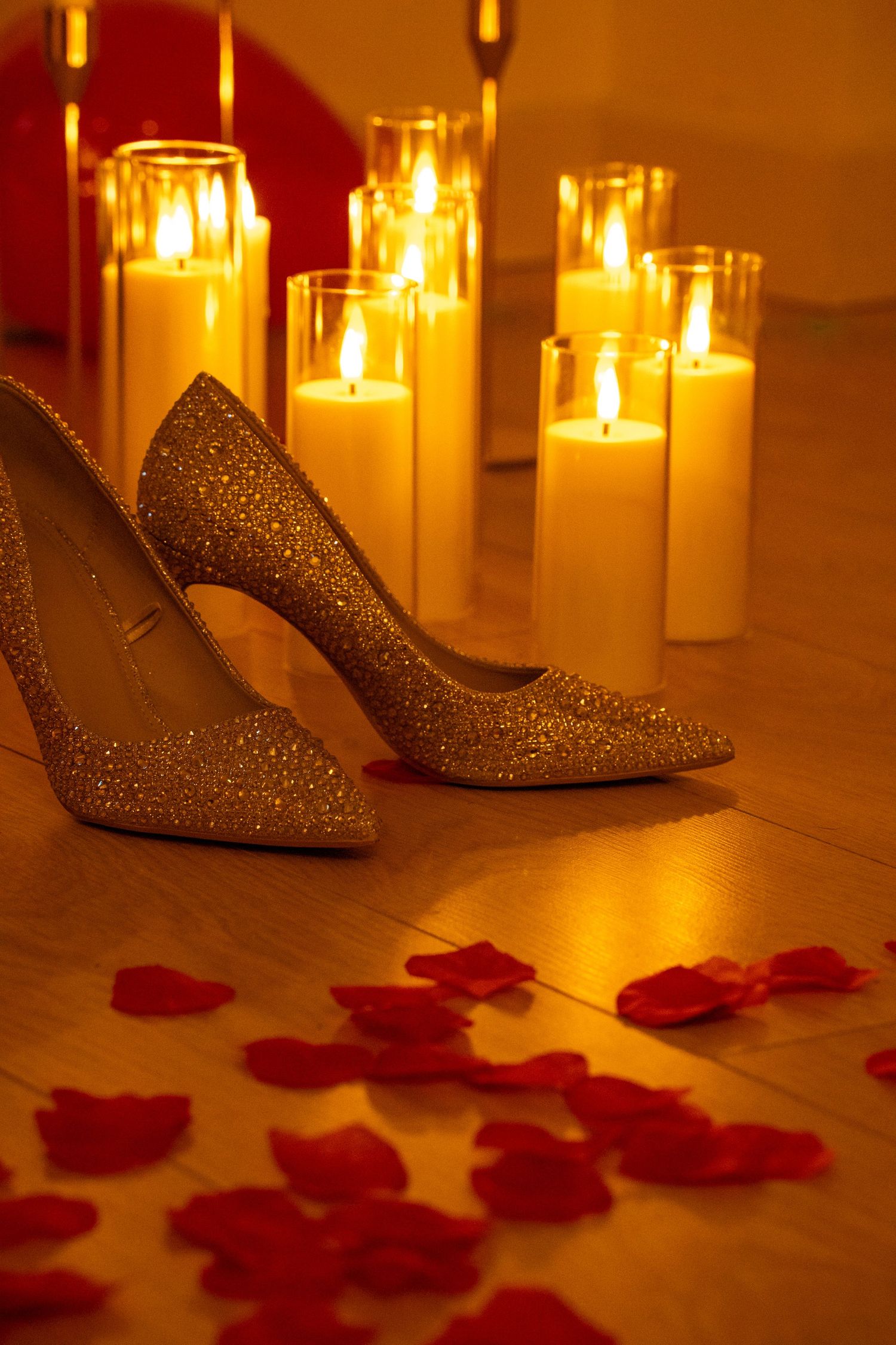 detail shot of heels roses candles and rose petals. Tied in Time Photography.