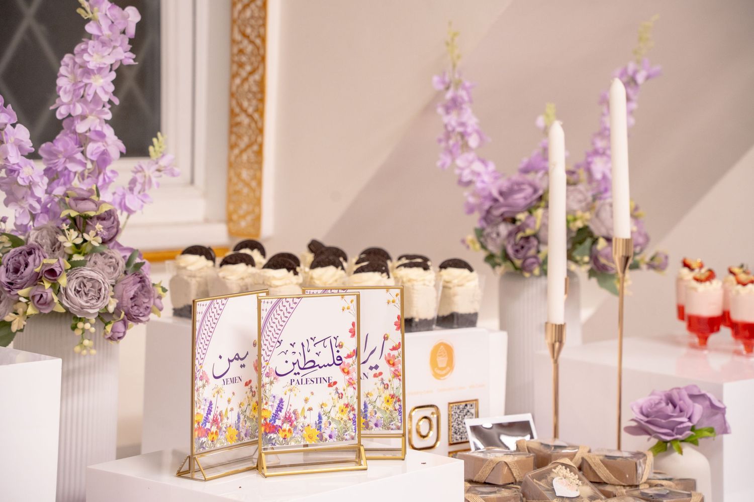 deserts table, purple and white flowers, Oreo cheesecake, strawberry trifle, long candles with rose gold candle holders. Tied in Time Photos