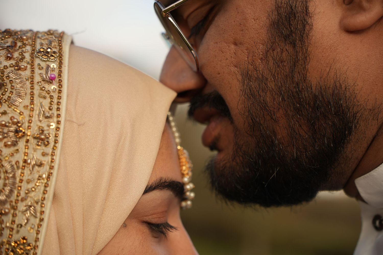 bride and groom kissing forehead. Tied in Time Photography.