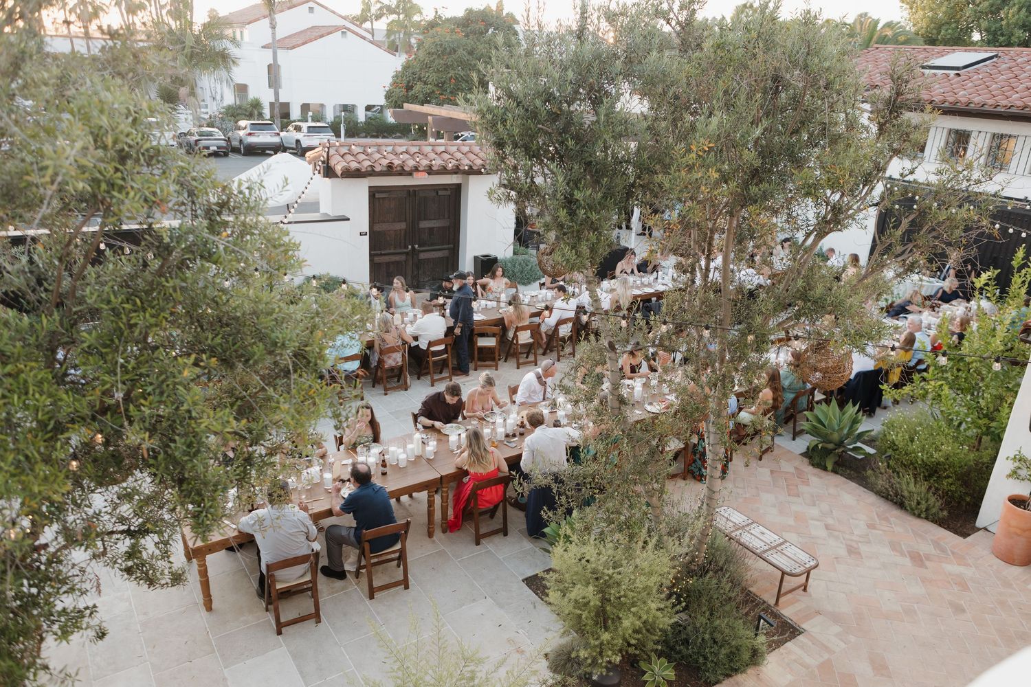 An aerial view of an outdoor wedding reception in San Clemente California. Agape San Clemente wedding venue photography