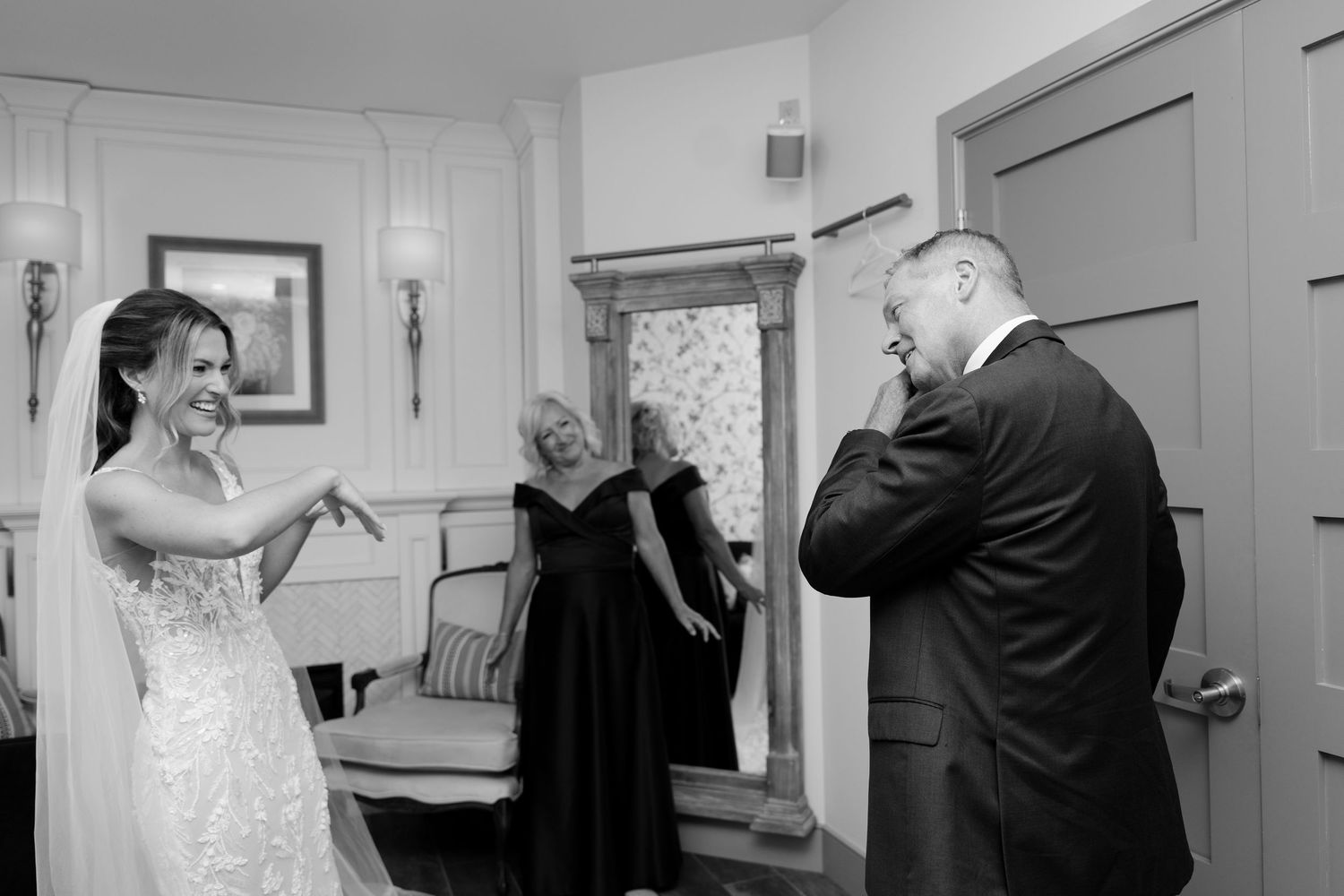 Black and white photo of emotional father seeing bride daughter in wedding dress for the first time at St Marys Venue.