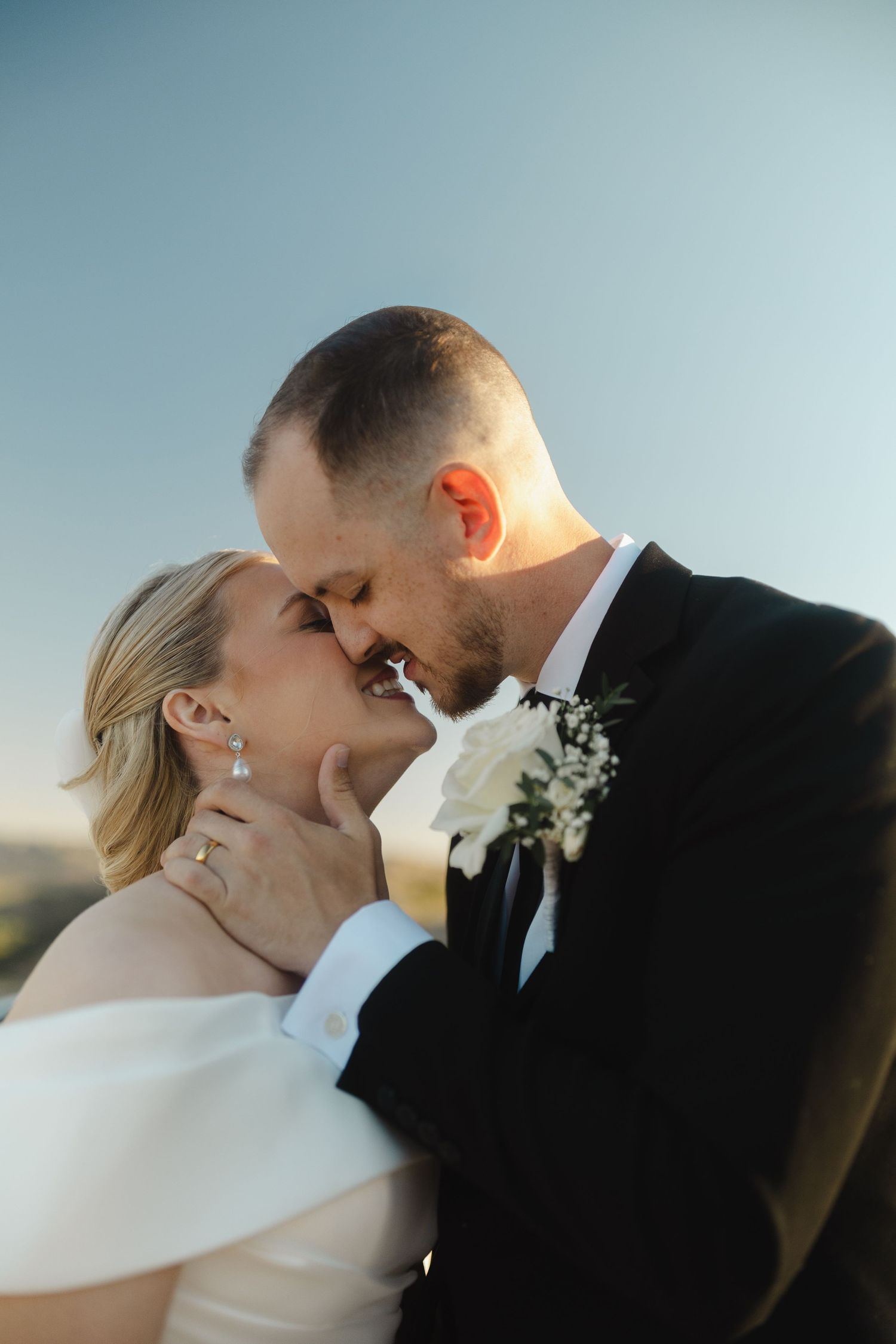 Artistic series of romantic wedding portraits capturing tender moments between newlyweds.