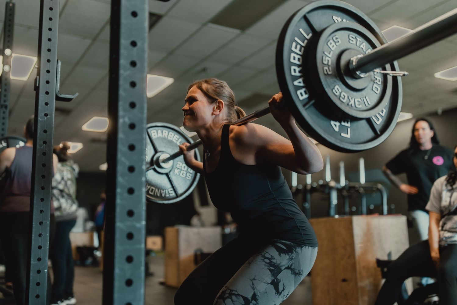 Series of weightlifting shots showing proper form with heavy barbell exercises.