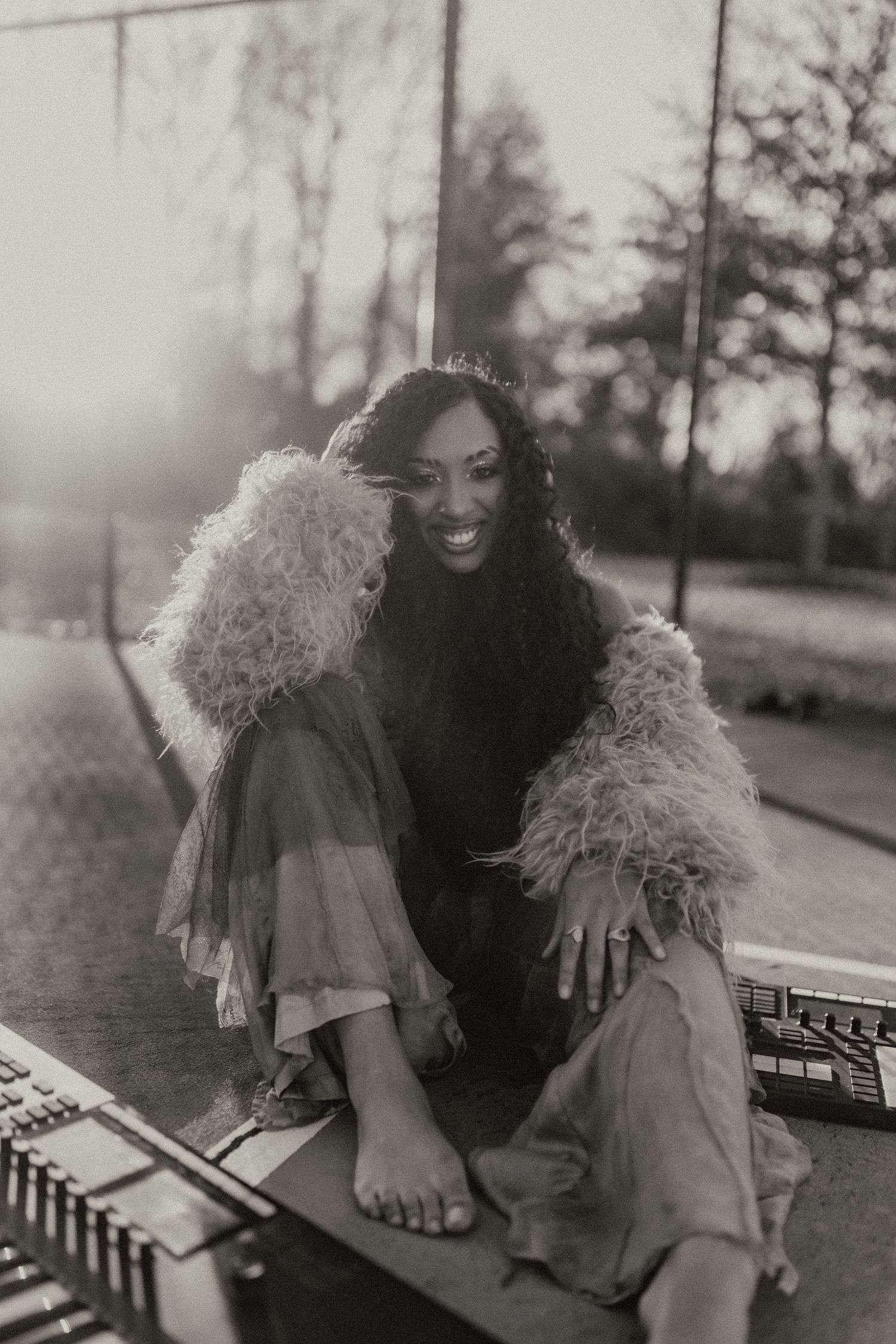 Black and white portraits showing playful expressions and fluffy collar detail.