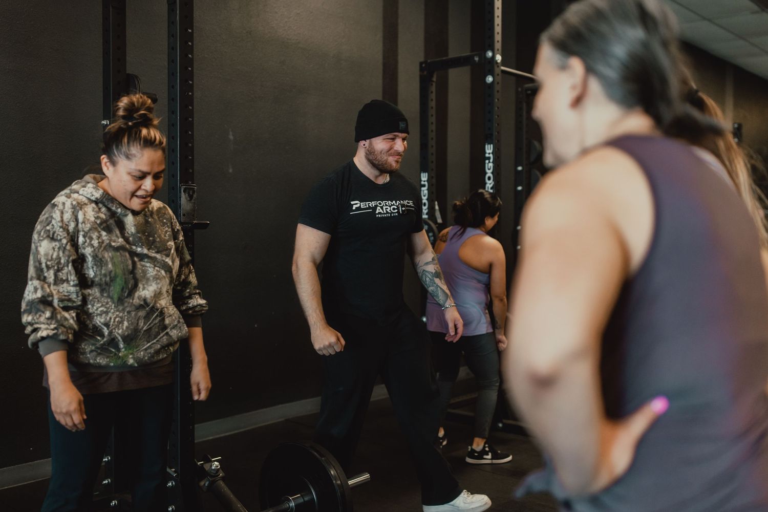 Group workout session in progress at a modern fitness facility with equipment.