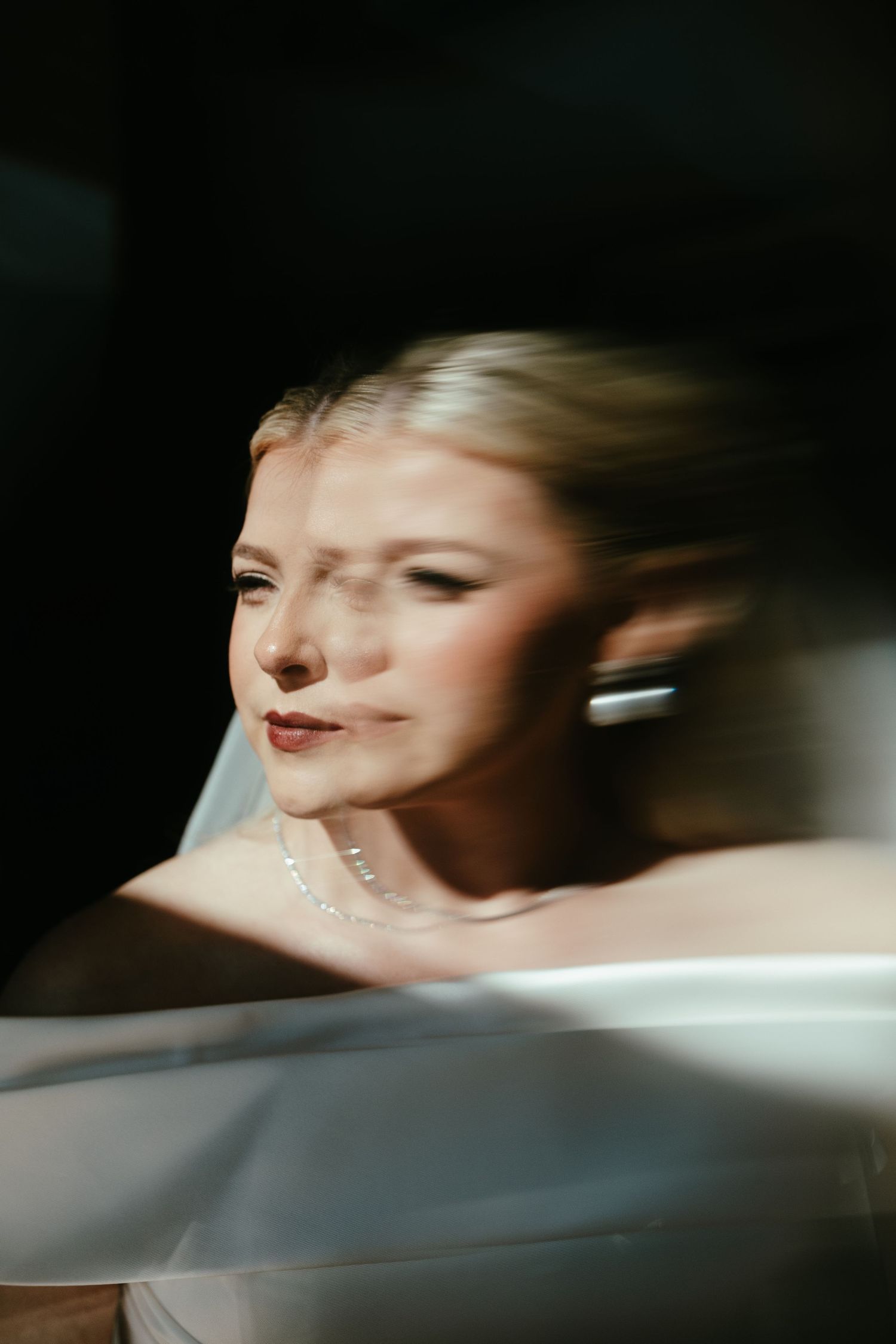 Artistic multiple exposure portrait showing movement in black and white.