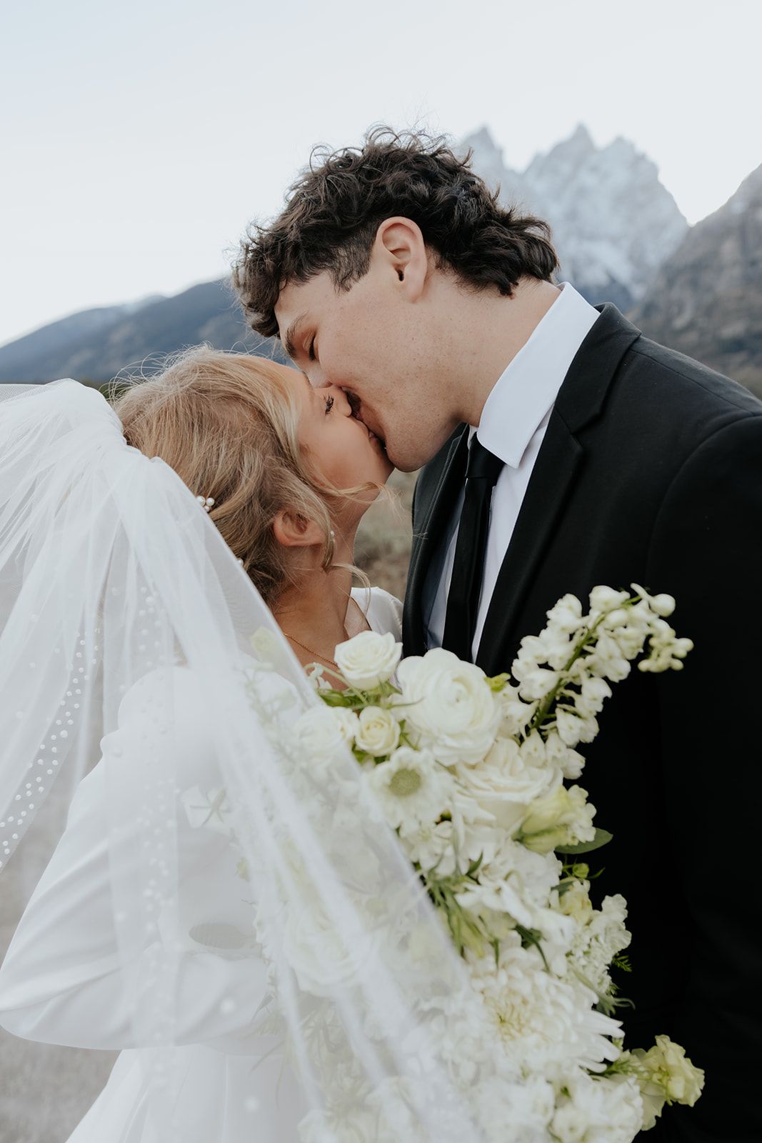 Wedding photos in Grand Teton National park, veil swept across the camera