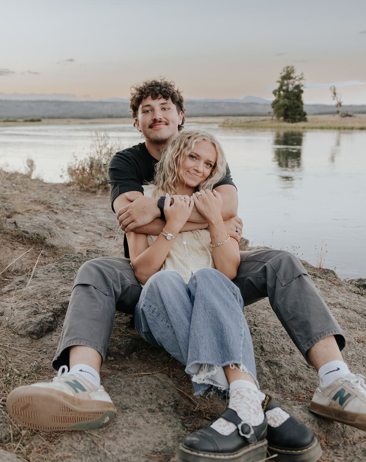 Couples engagement session at Harriman State Park in Island Park, Idaho by the lake in August at sunset