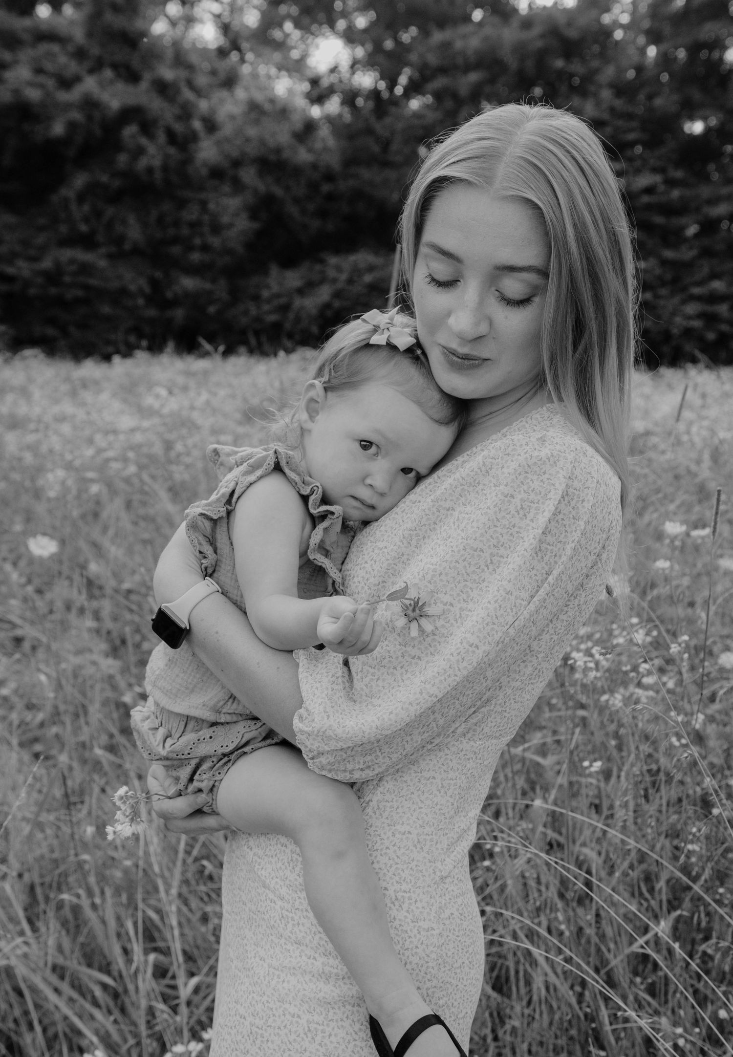 Mother and daughter candid moment during family photoshoot in Springfield, Missouri. Black and white photo