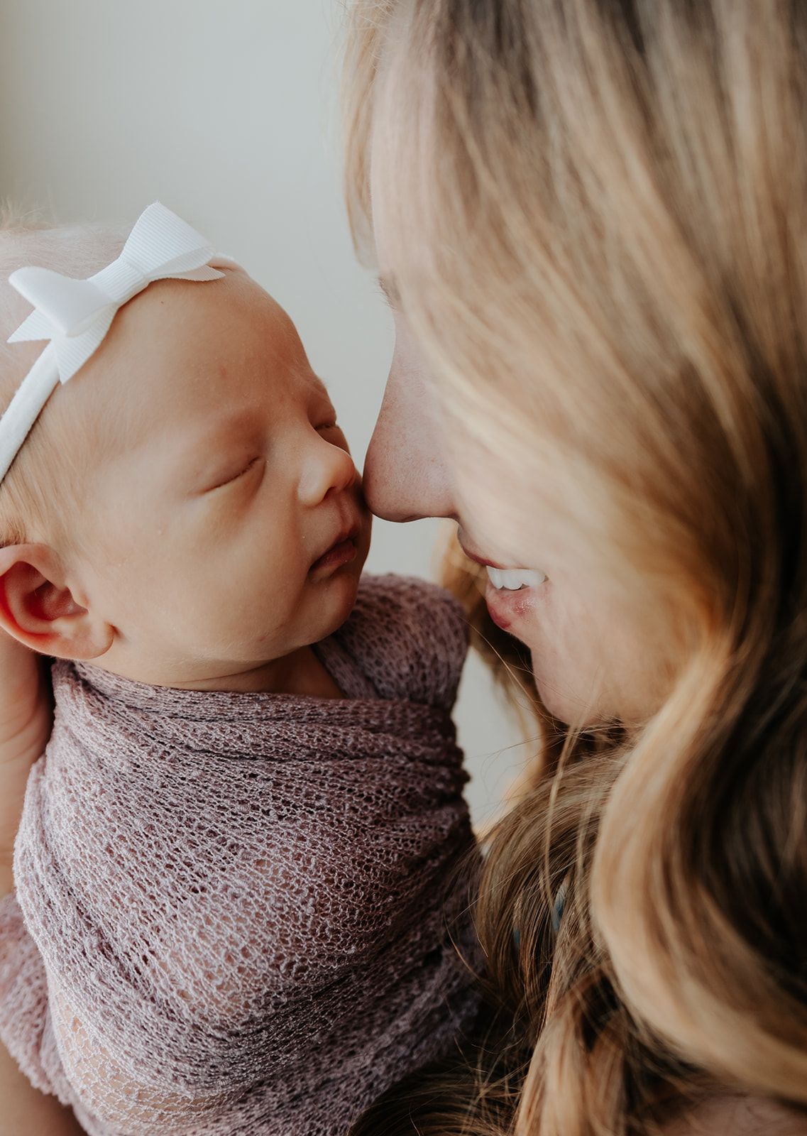 Mother and newborn during in-home newborn photoshoot in Springfield, Missouri. Intimate and candid newborn photoshoot