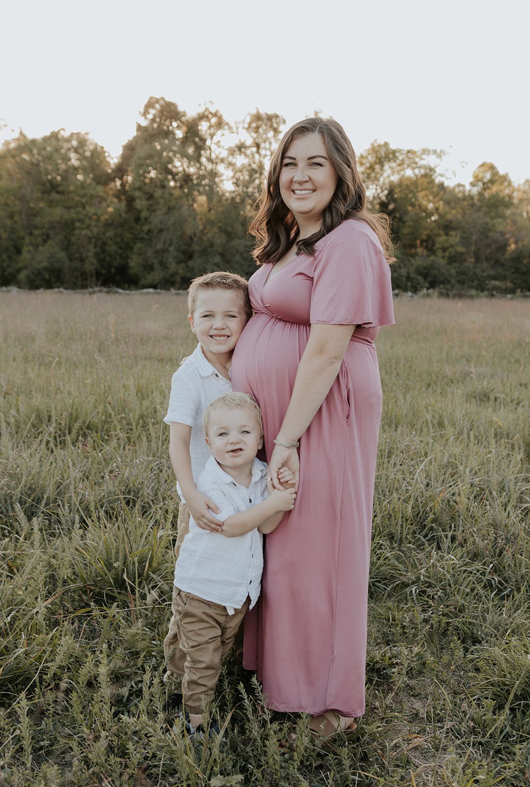 Mother with sons during maternity photoshoot in Springfield, Missouri