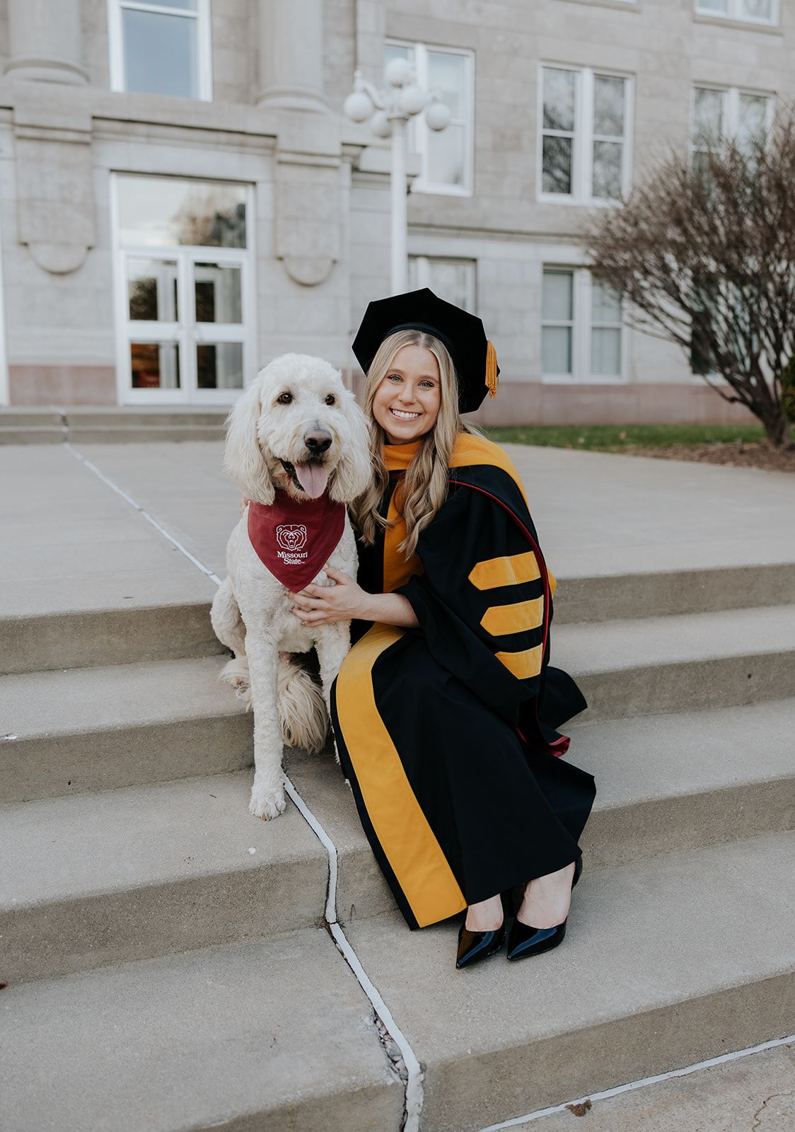 Graduation photos with dog at Missouri State University, Carrington Hall