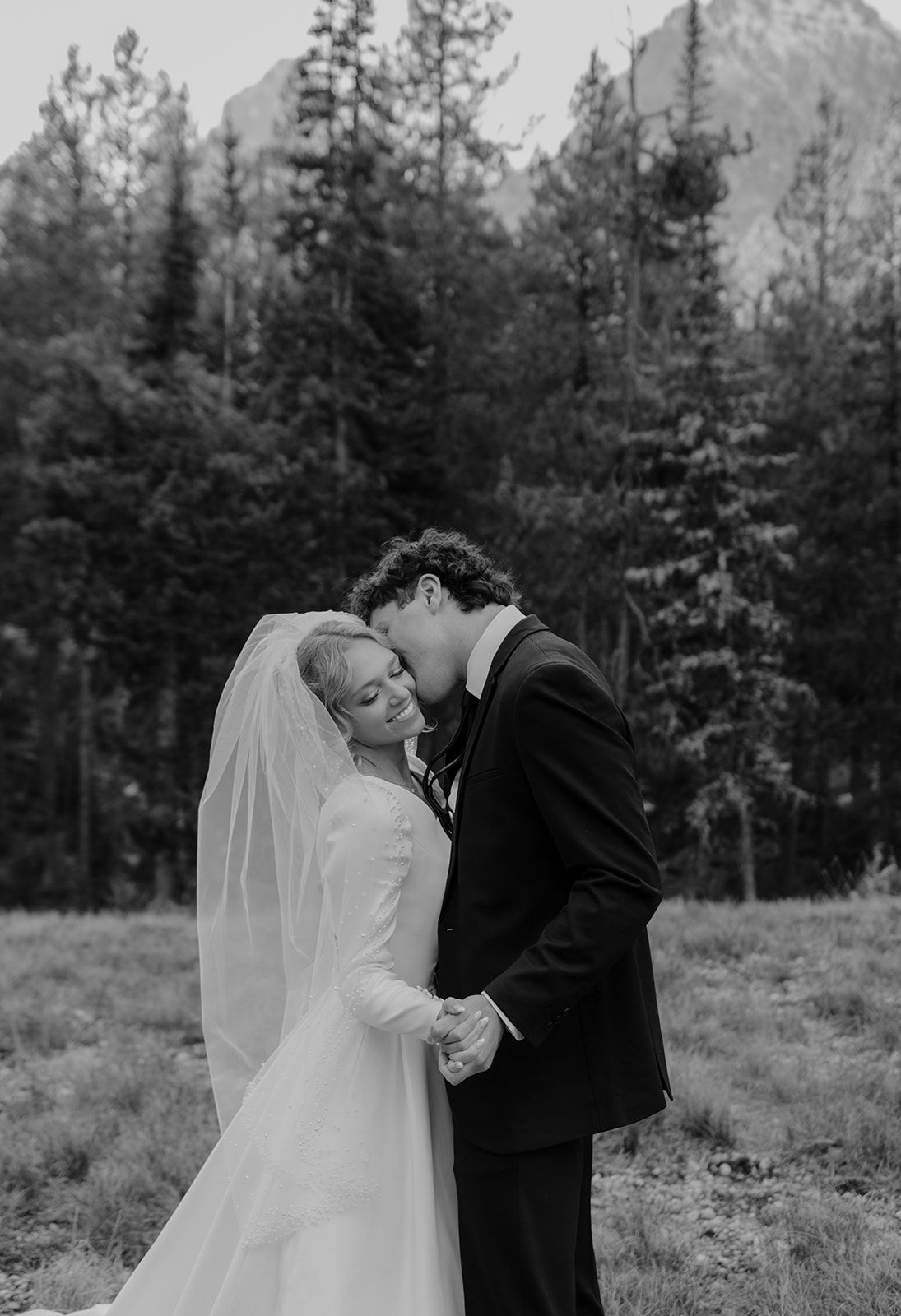 First look in Grand Teton National Park during bridal photos, black and white wedding photo