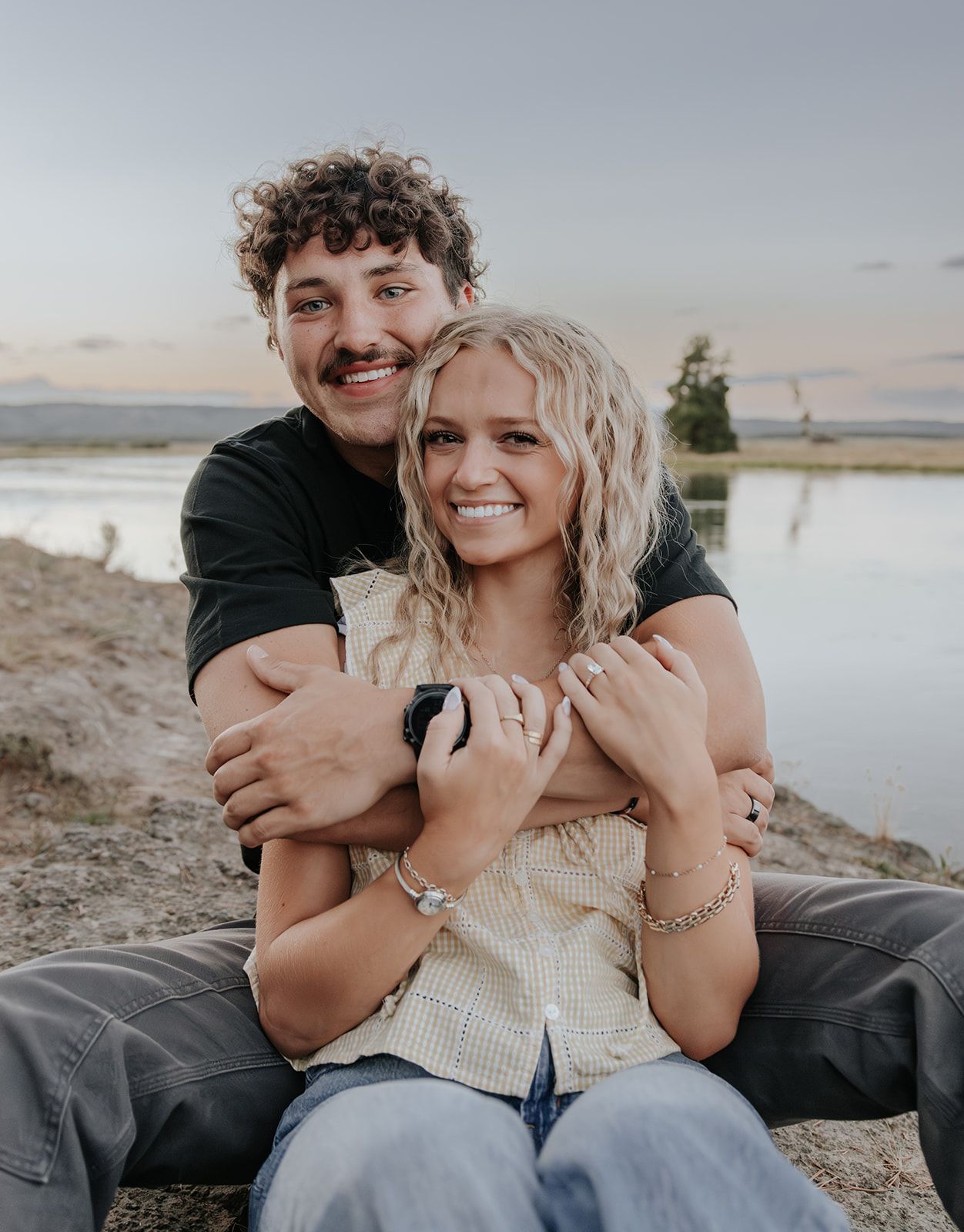 Engagement photos at Harriman State Park in Island Park, Idaho by the lake in August at sunset