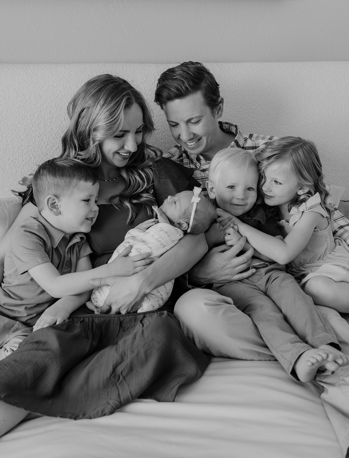 In-home newborn photoshoot in Springfield, Missouri. Intimate and candid newborn photoshoot. Family with newborn baby, black and white image