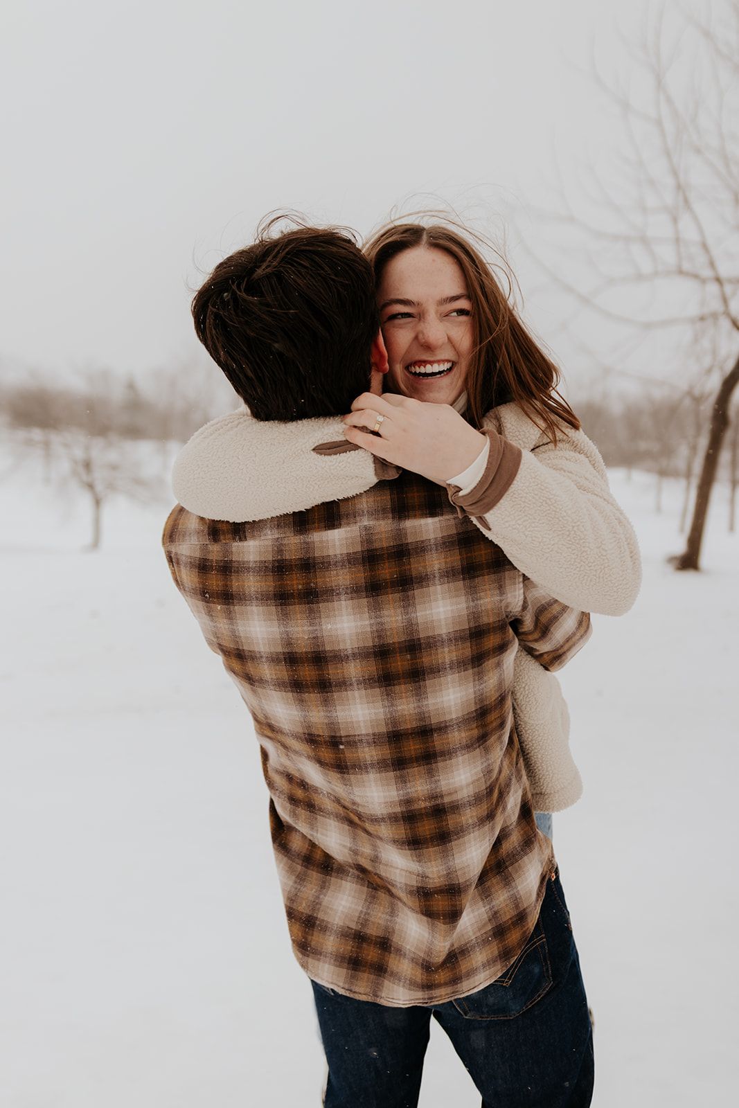 Candid couples engagement photos in Springfield, Missouri in the snow