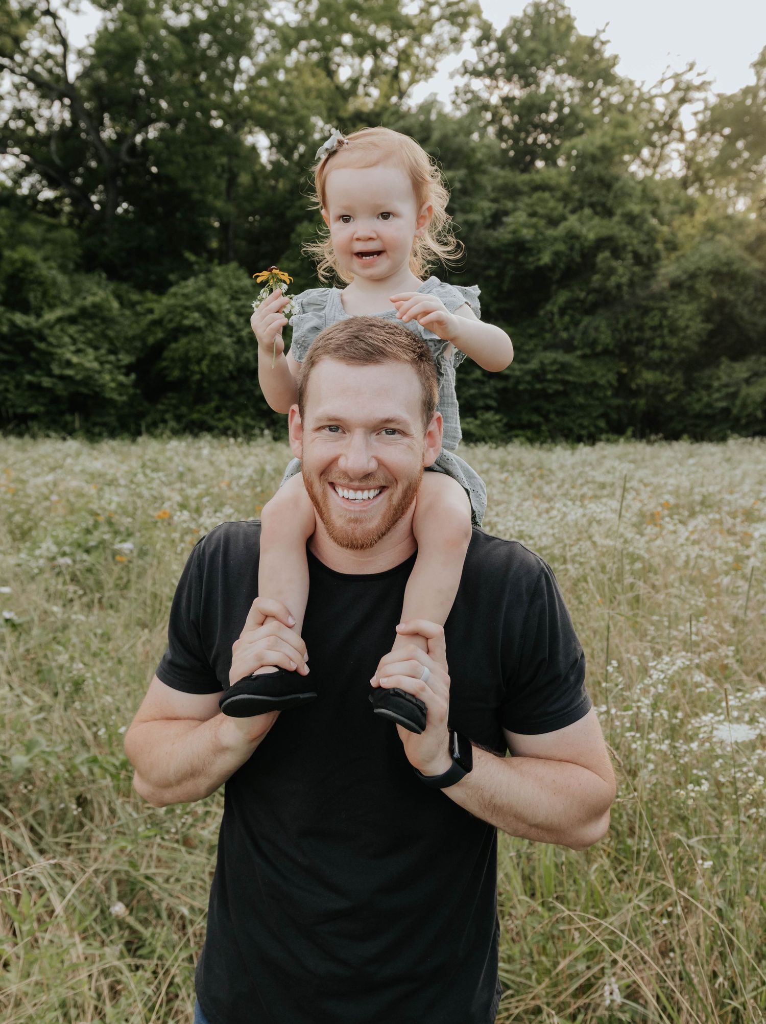 Father and daughter candid moment during family photoshoot in Springfield, Missouri