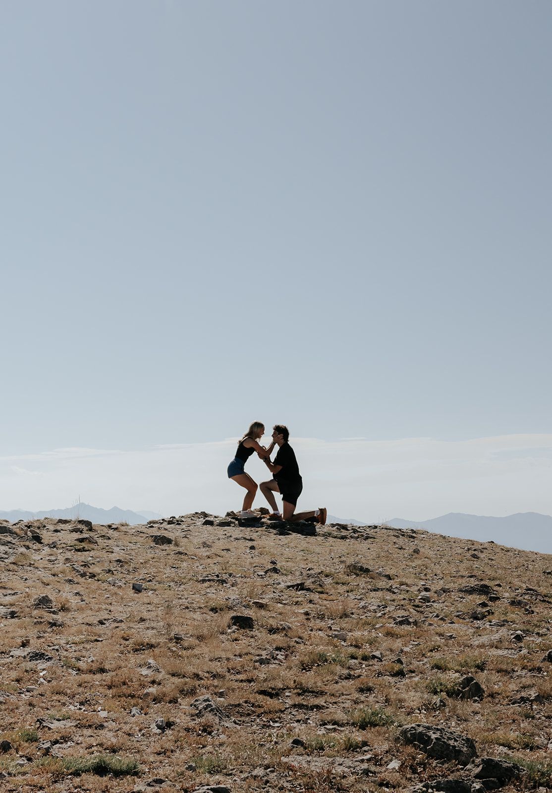 Proposal on a hike in Jackson, Wyoming near the Tetons in the summer