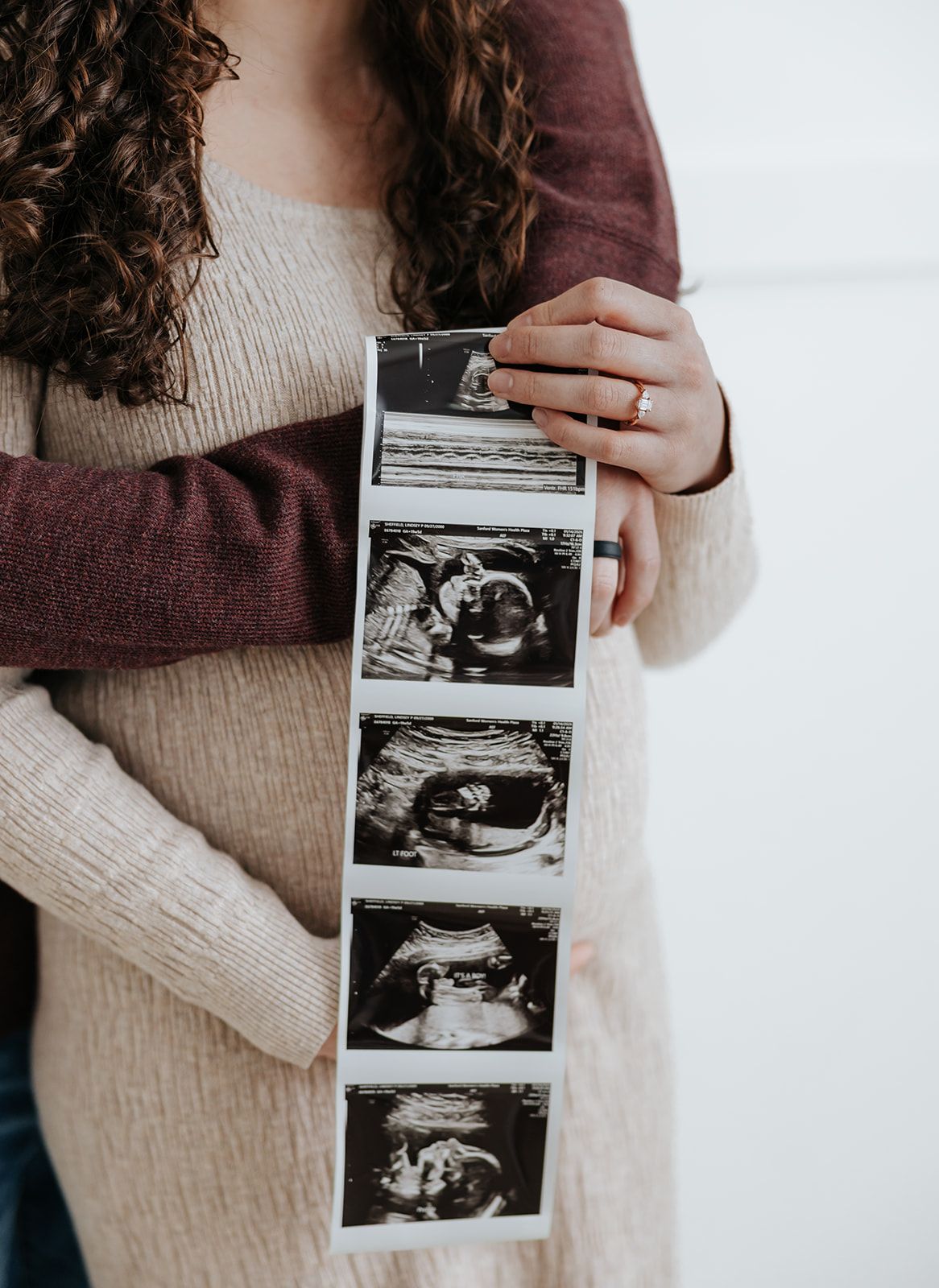 Detailed photo of ultrasound photos during maternity photoshoot