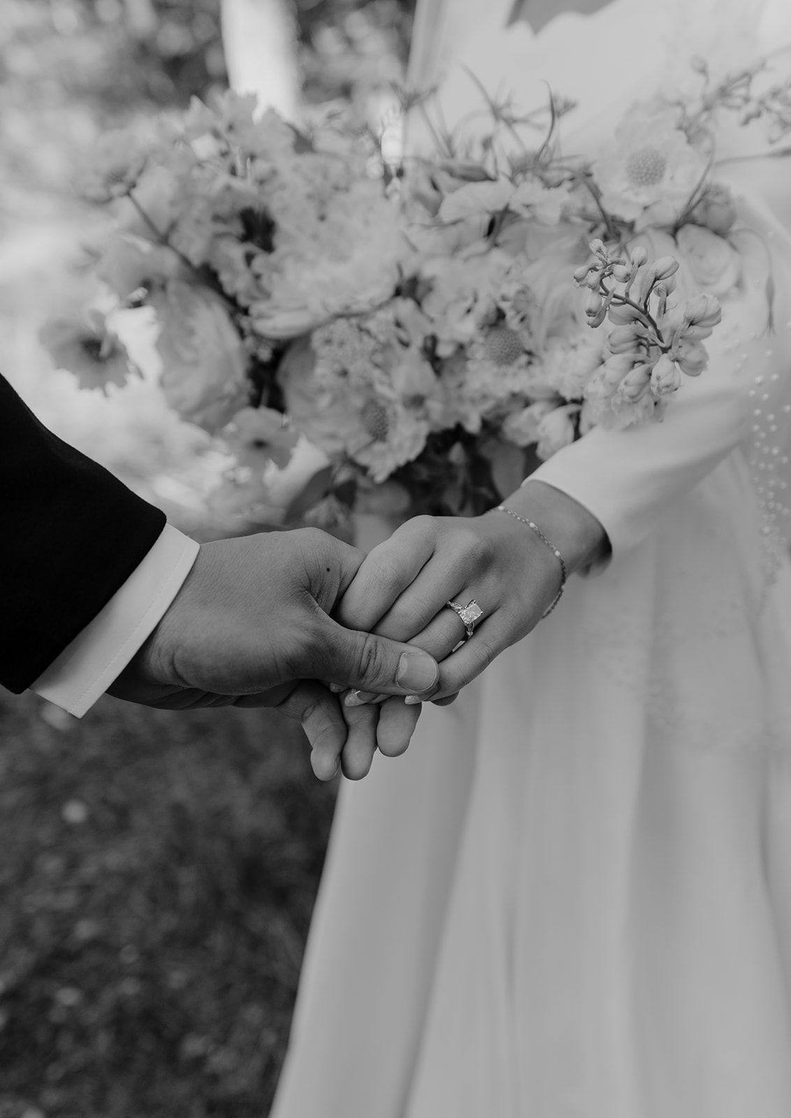 Detail shot of wedding ring and bridal bouquet, bridal photos outside