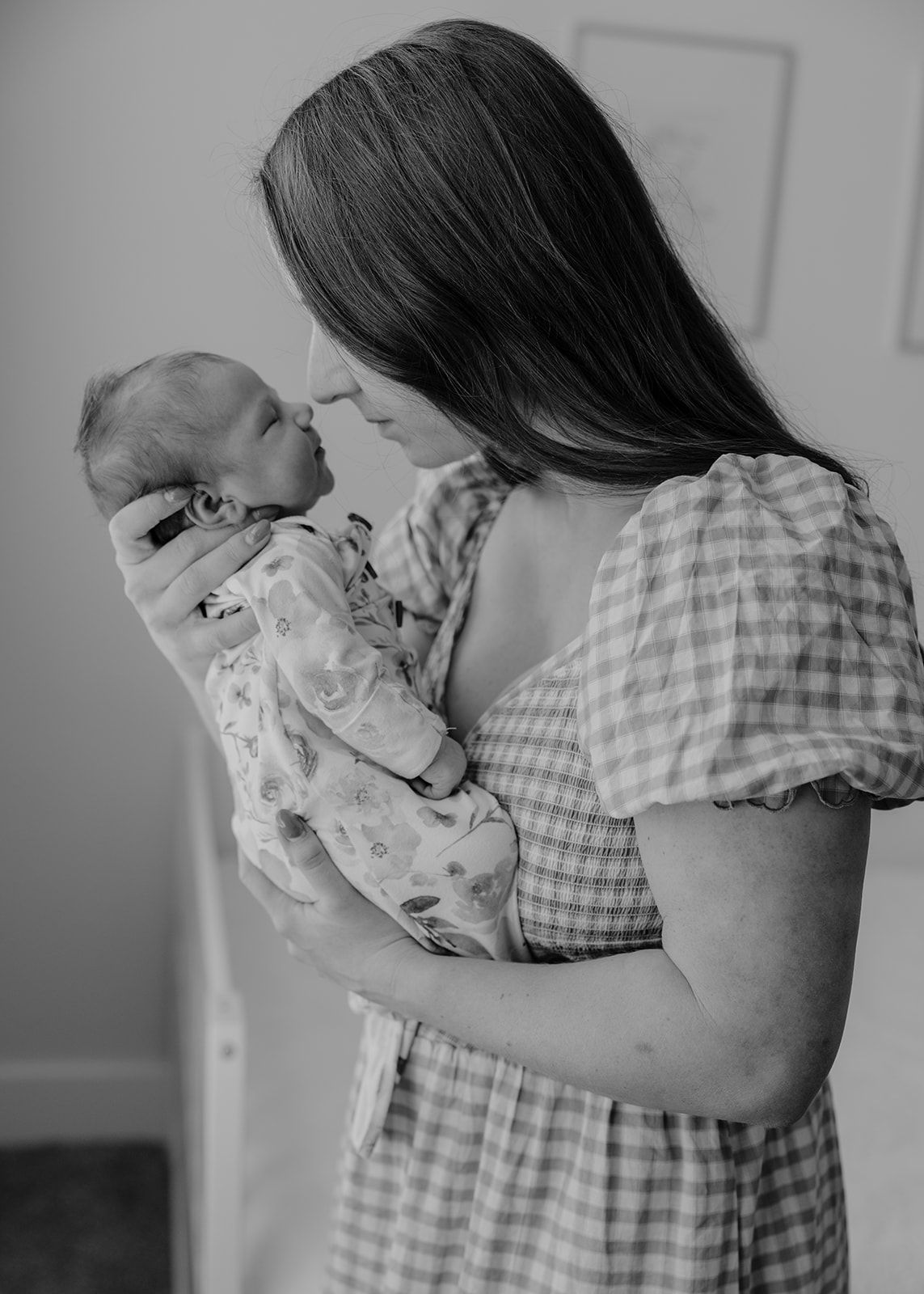 In-home newborn photos, mom holding baby