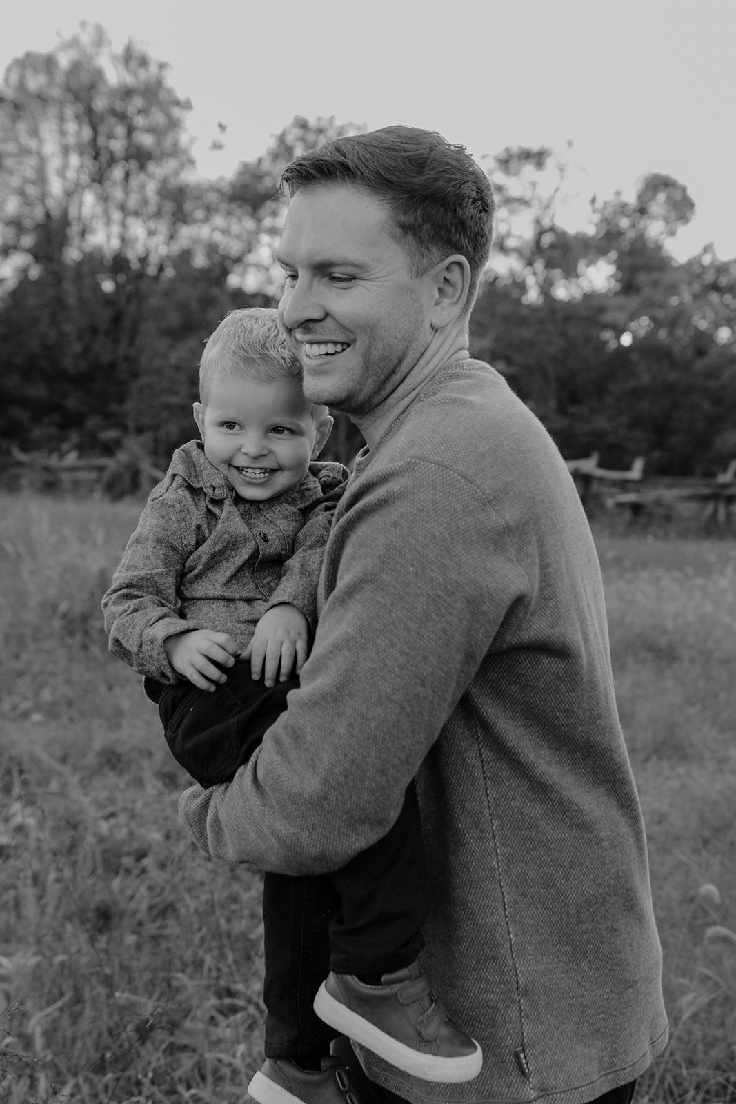 Father and son candid moment during family photoshoot