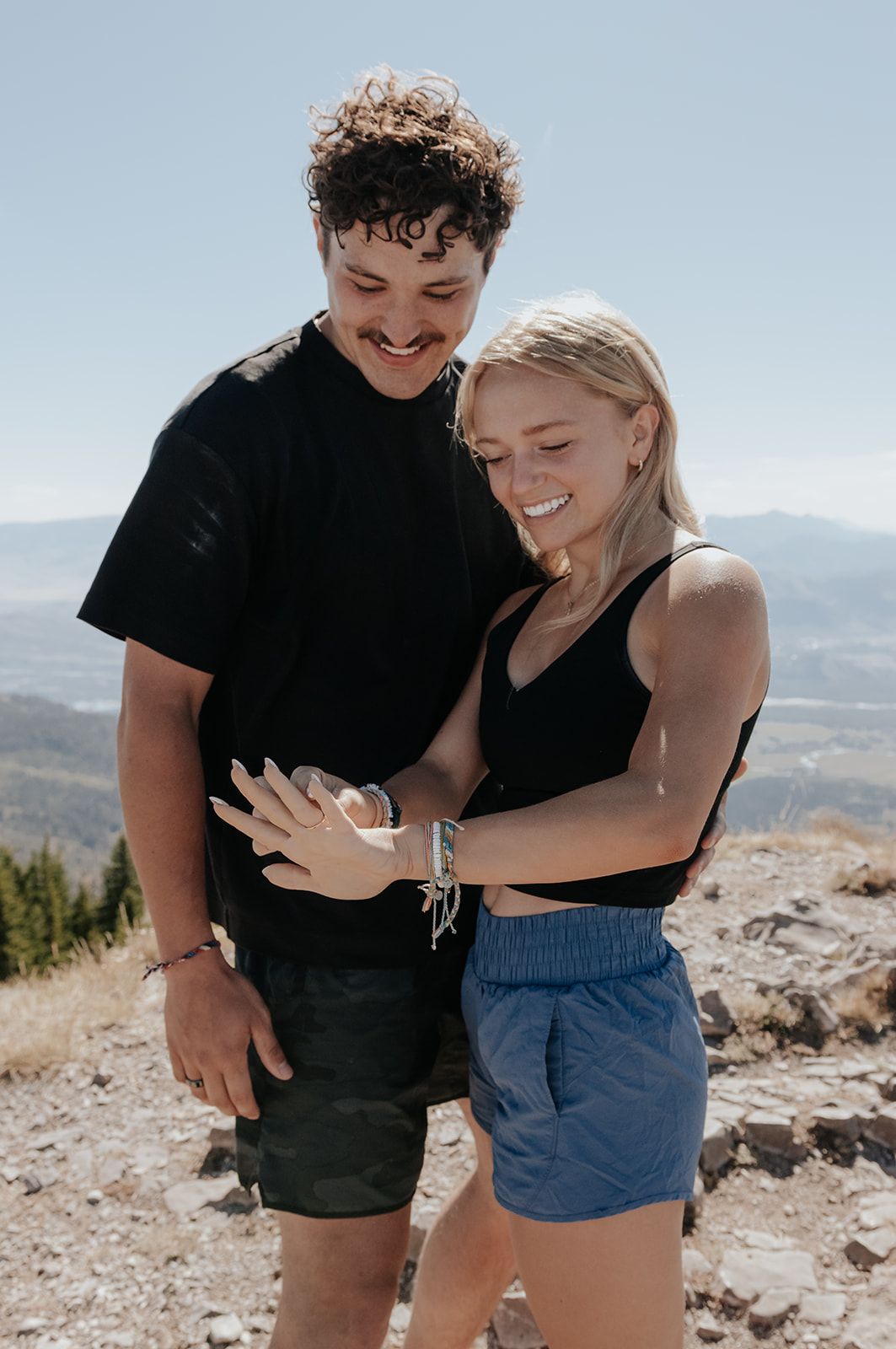 Looking at engagement ring after proposal in Jackson Hole, Wyoming