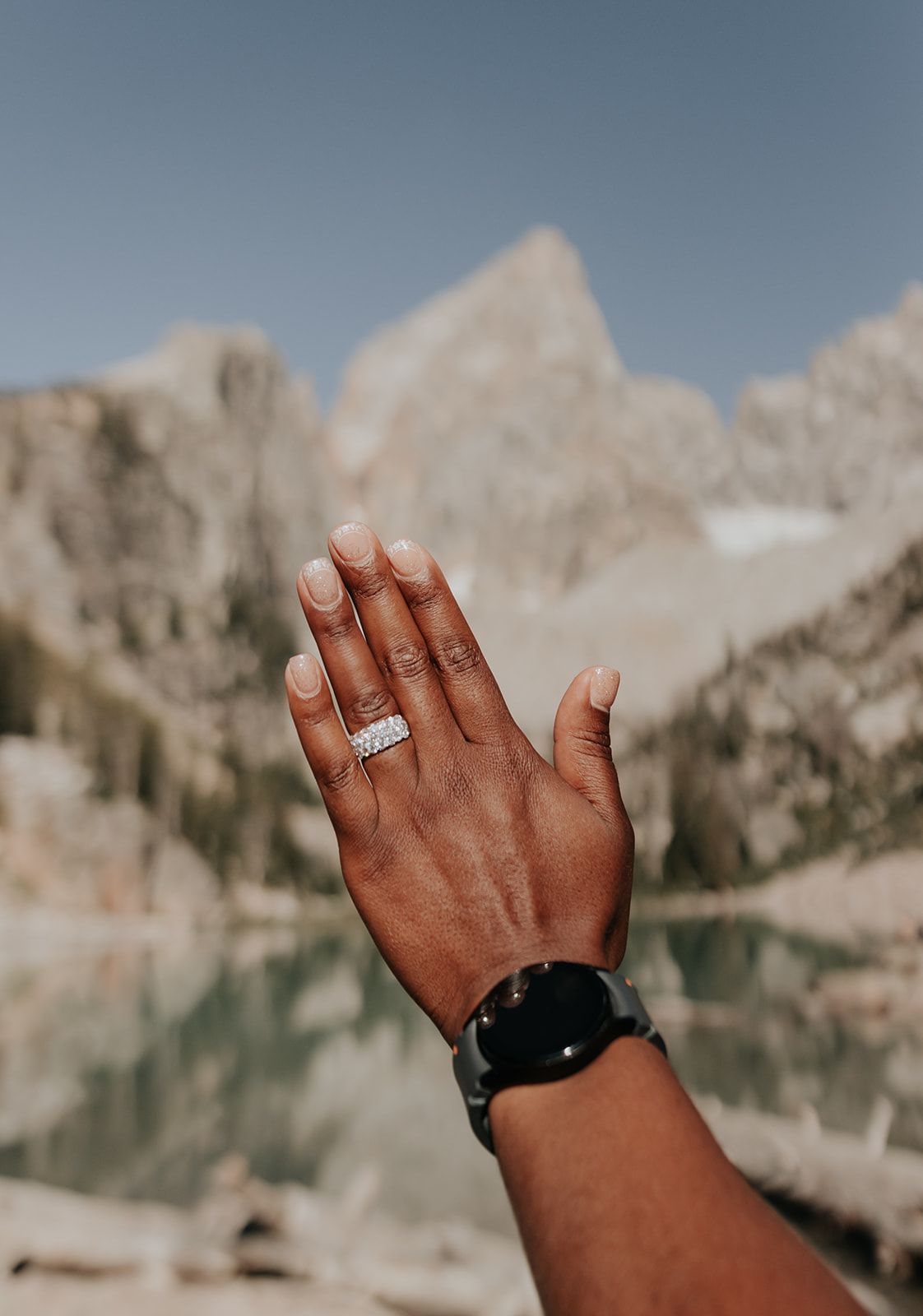 Detail shot of engagement ring after surprise proposal at Delta Lake in Grand Teton National Park