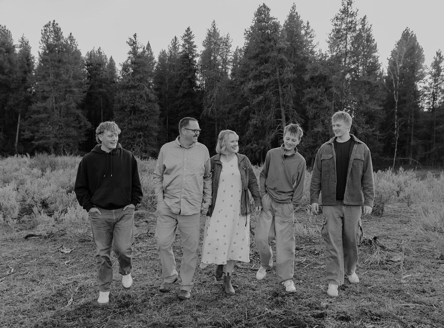 Family photoshoot near Kelly Canyon, Idaho. Family is walking and laughing. Candid family portrait