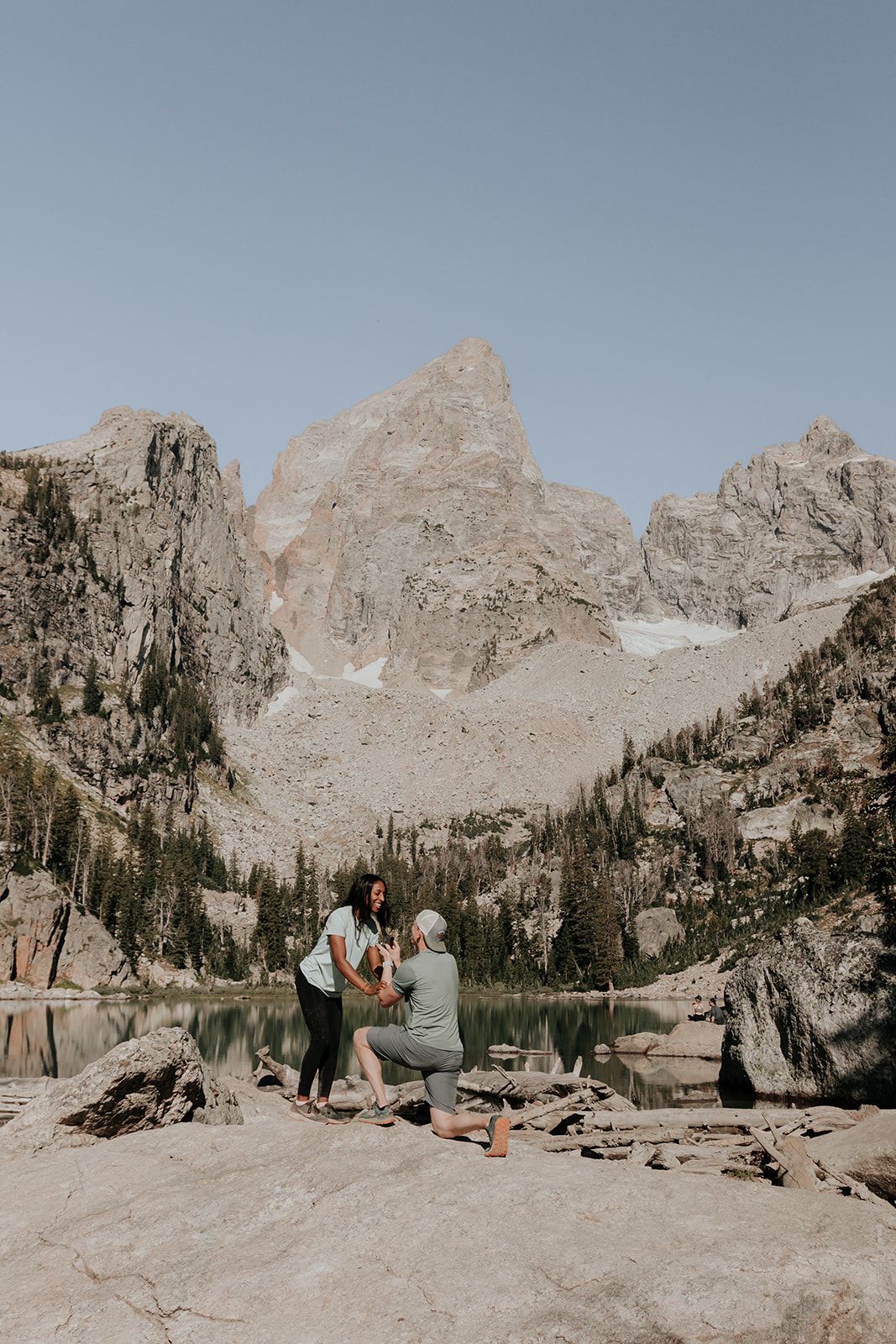 Surprise proposal at Delta Lake in Grand Teton National Park after hiking in the Tetons