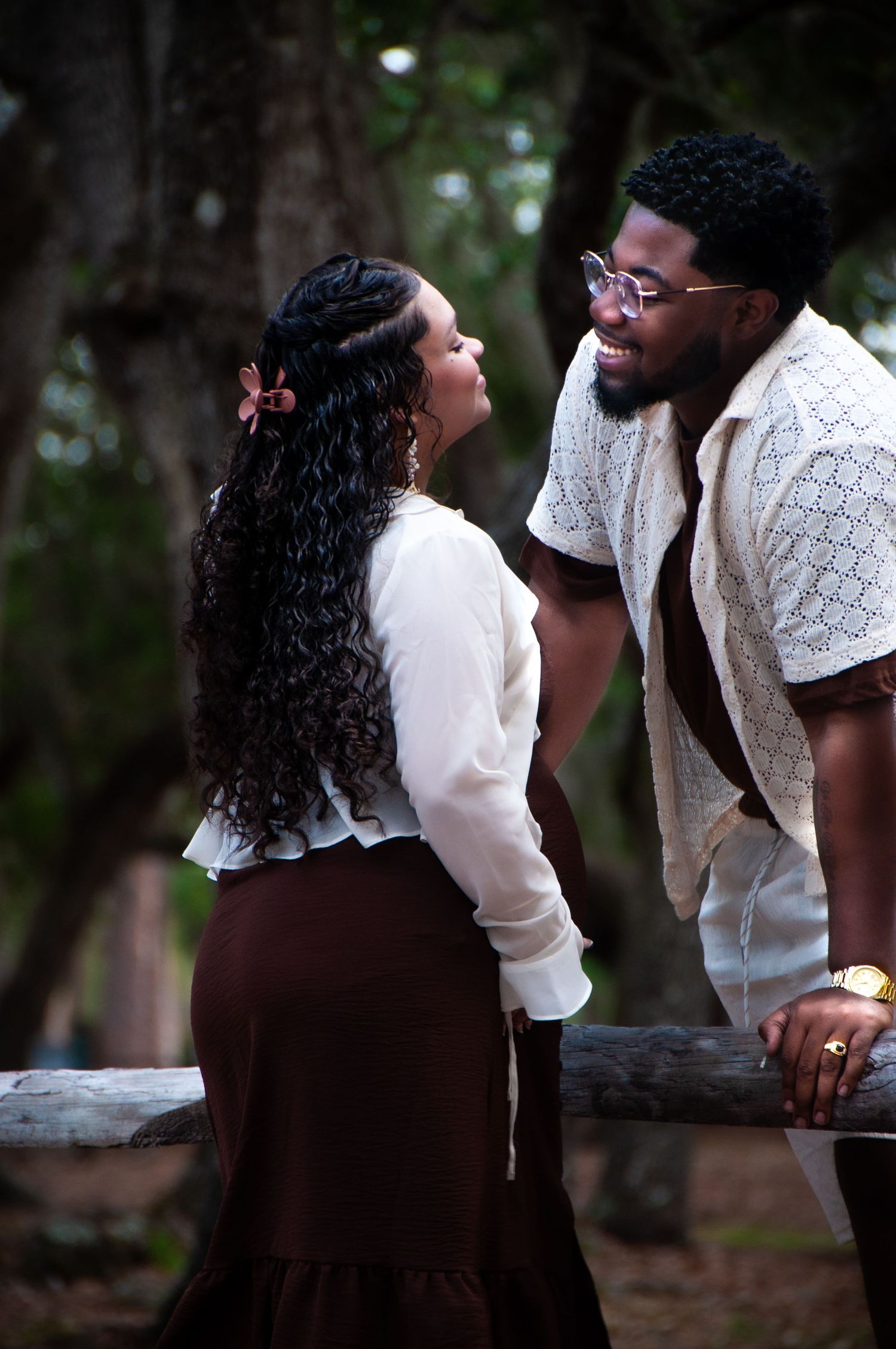 Series of romantic moments captured in a wooded outdoor setting.