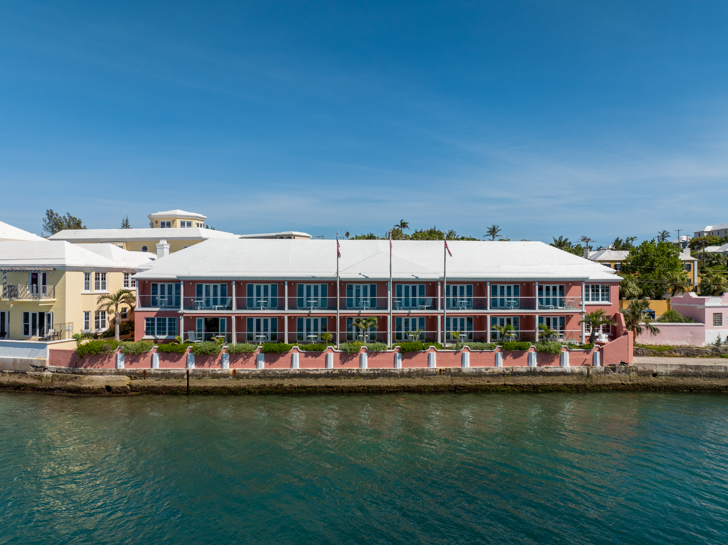 Waterfront view of colorful hotel buildings and condominiums along the shoreline. Drone photogrpahy.