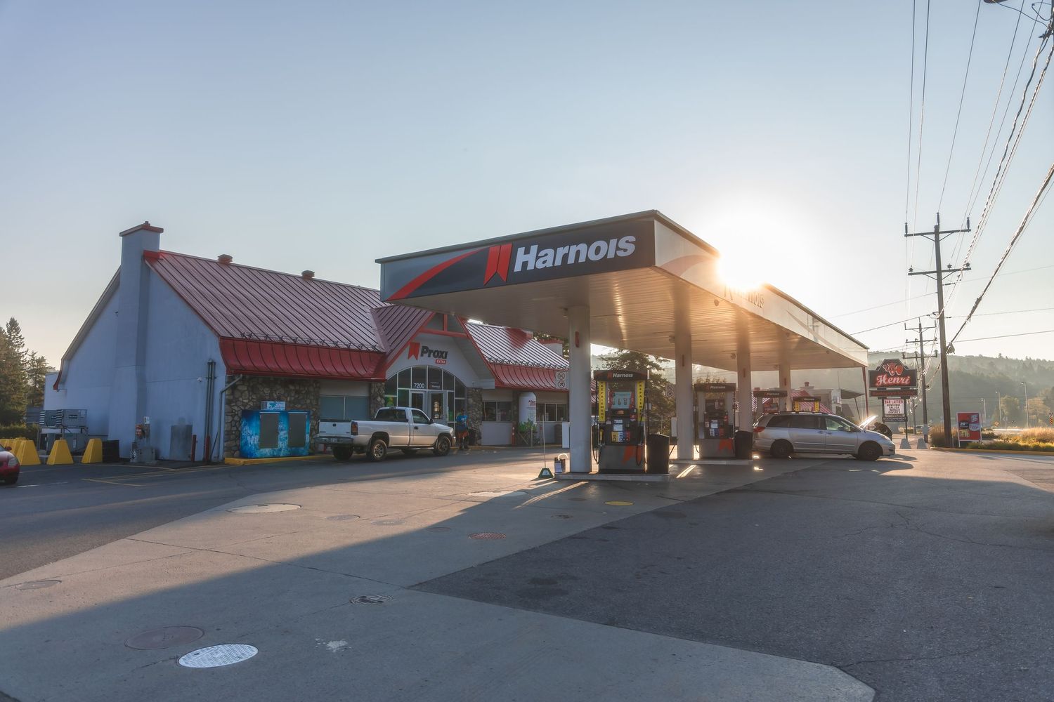 Panoramic sequence showing a Harmons grocery store exterior and parking lot at different times of day.