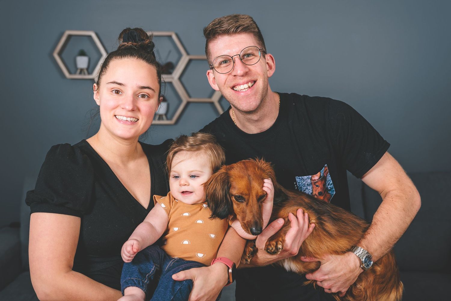 Family portrait series showing joyful expressions and tender moments against studio background.