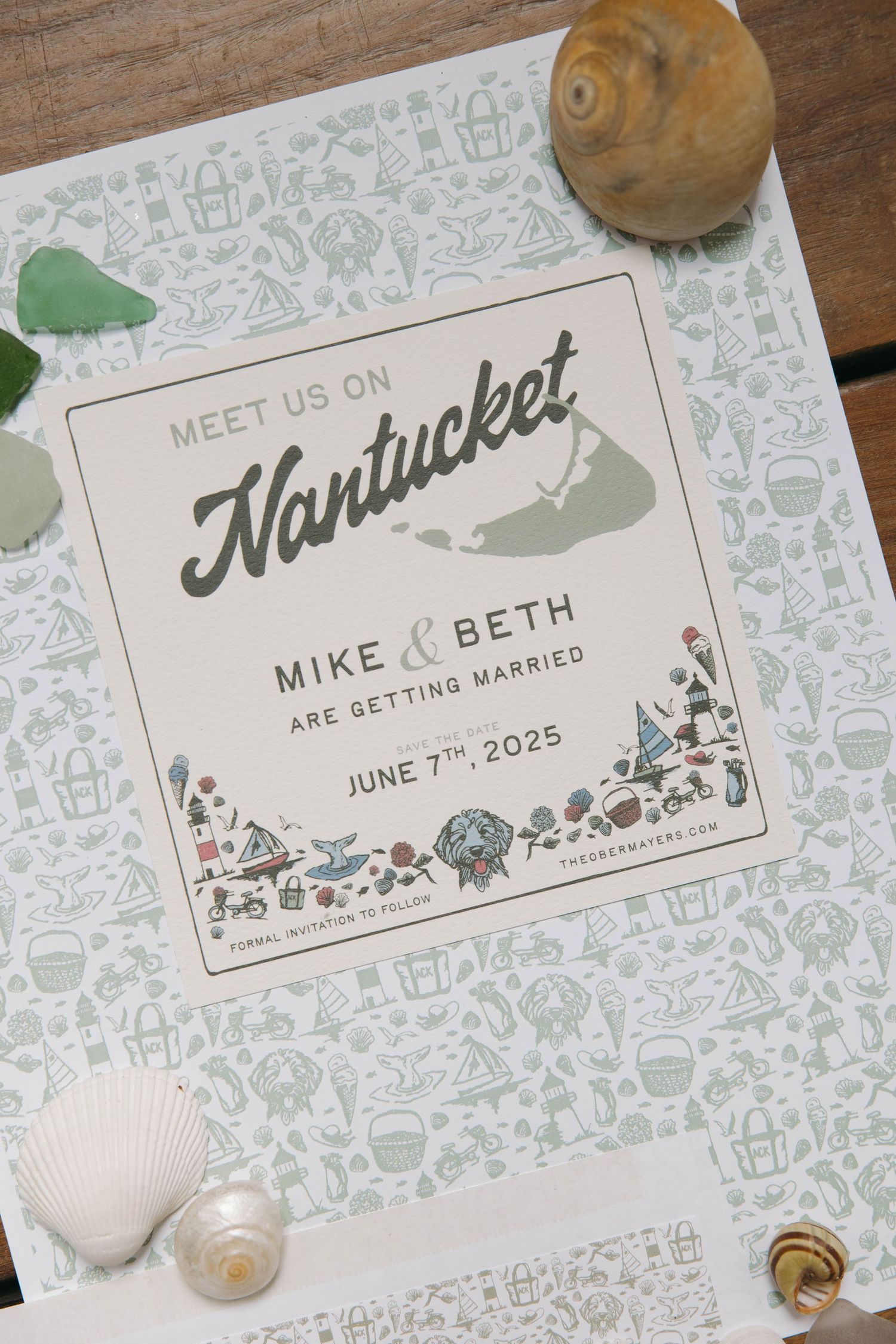 Wedding save-the-date card with Nantucket theme and floral design surrounded by seashells.