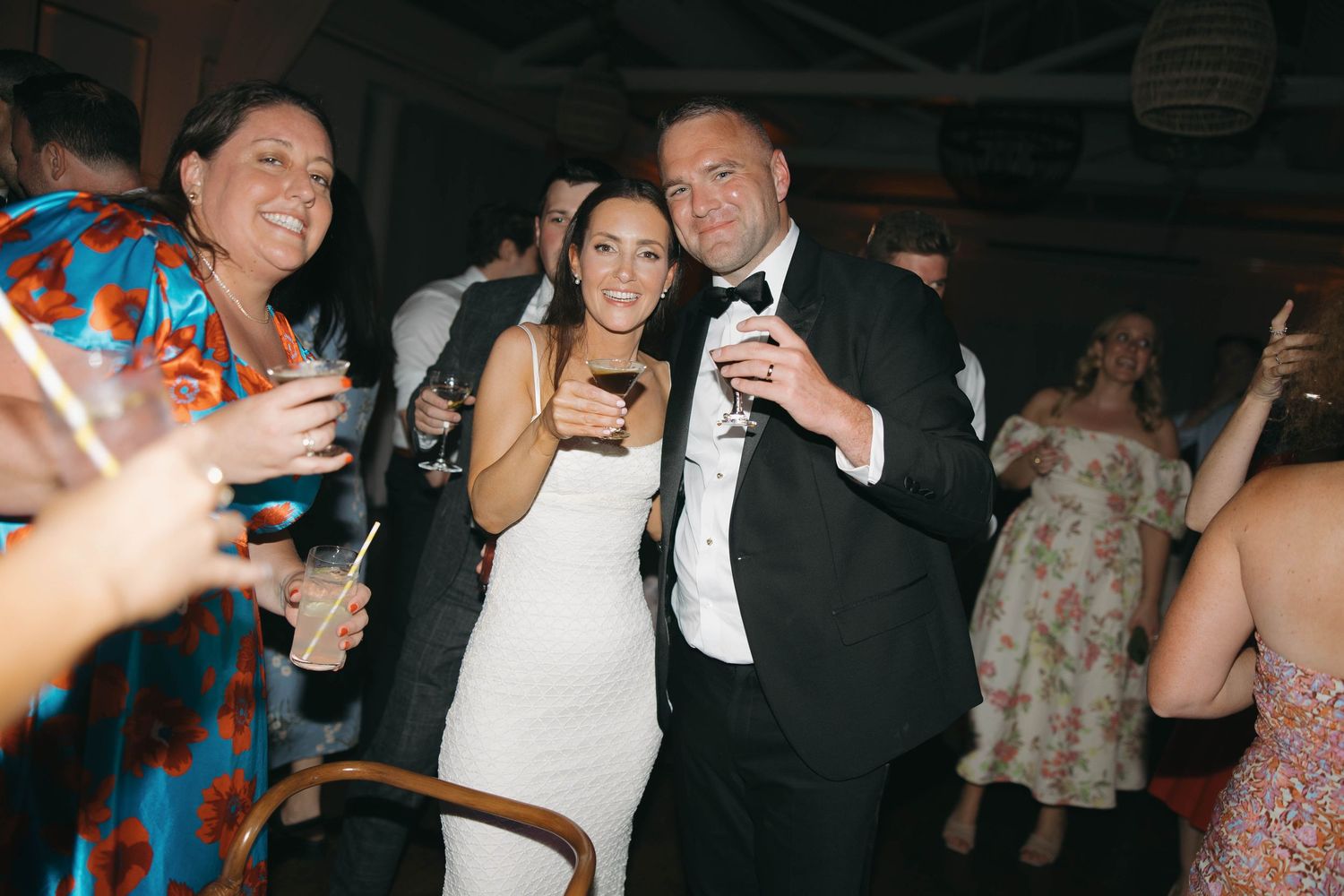 Guests dancing and celebrating at a wedding reception.