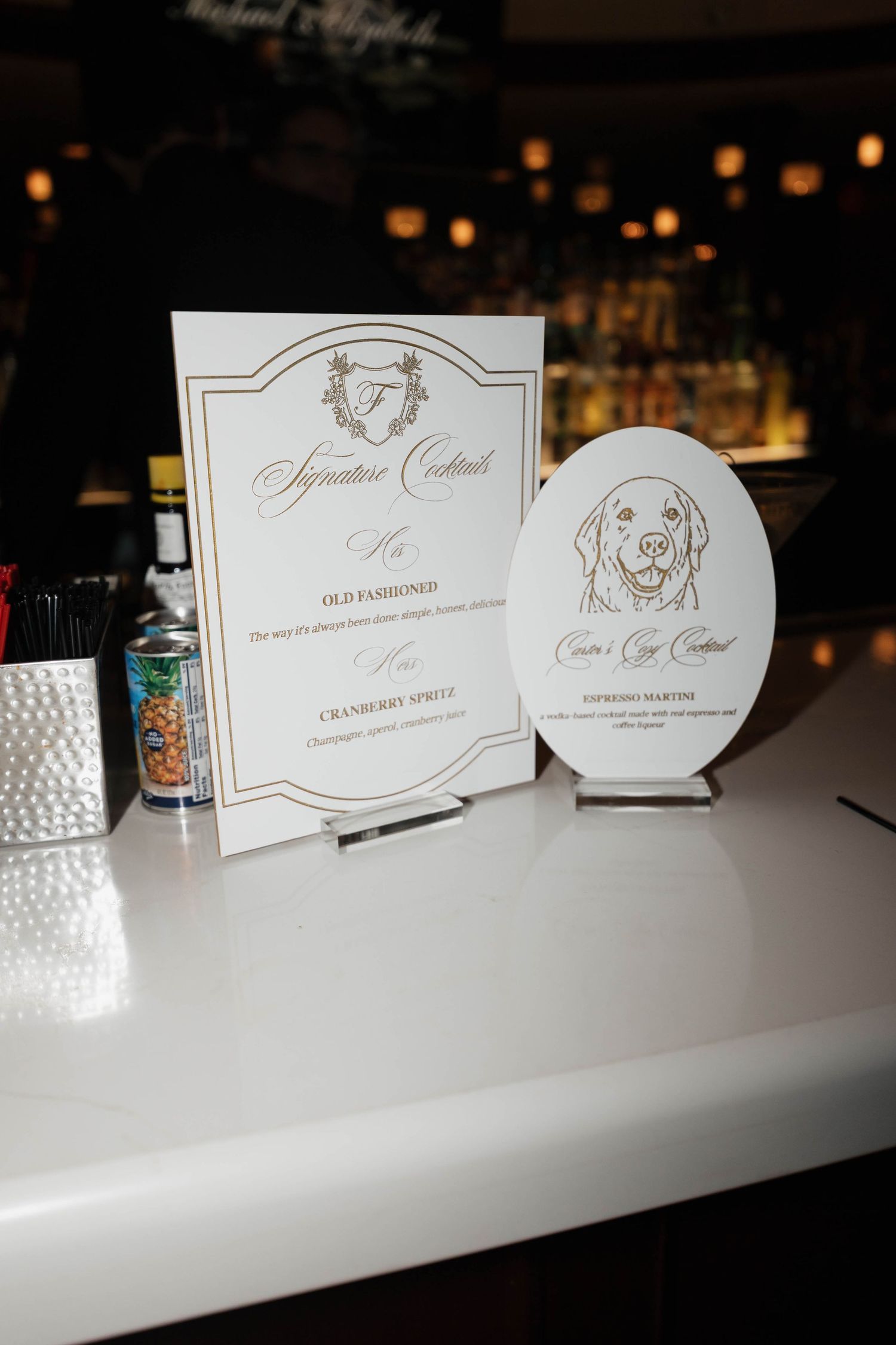 Wedding stationery featuring elegant design and dog illustration on display at reception.