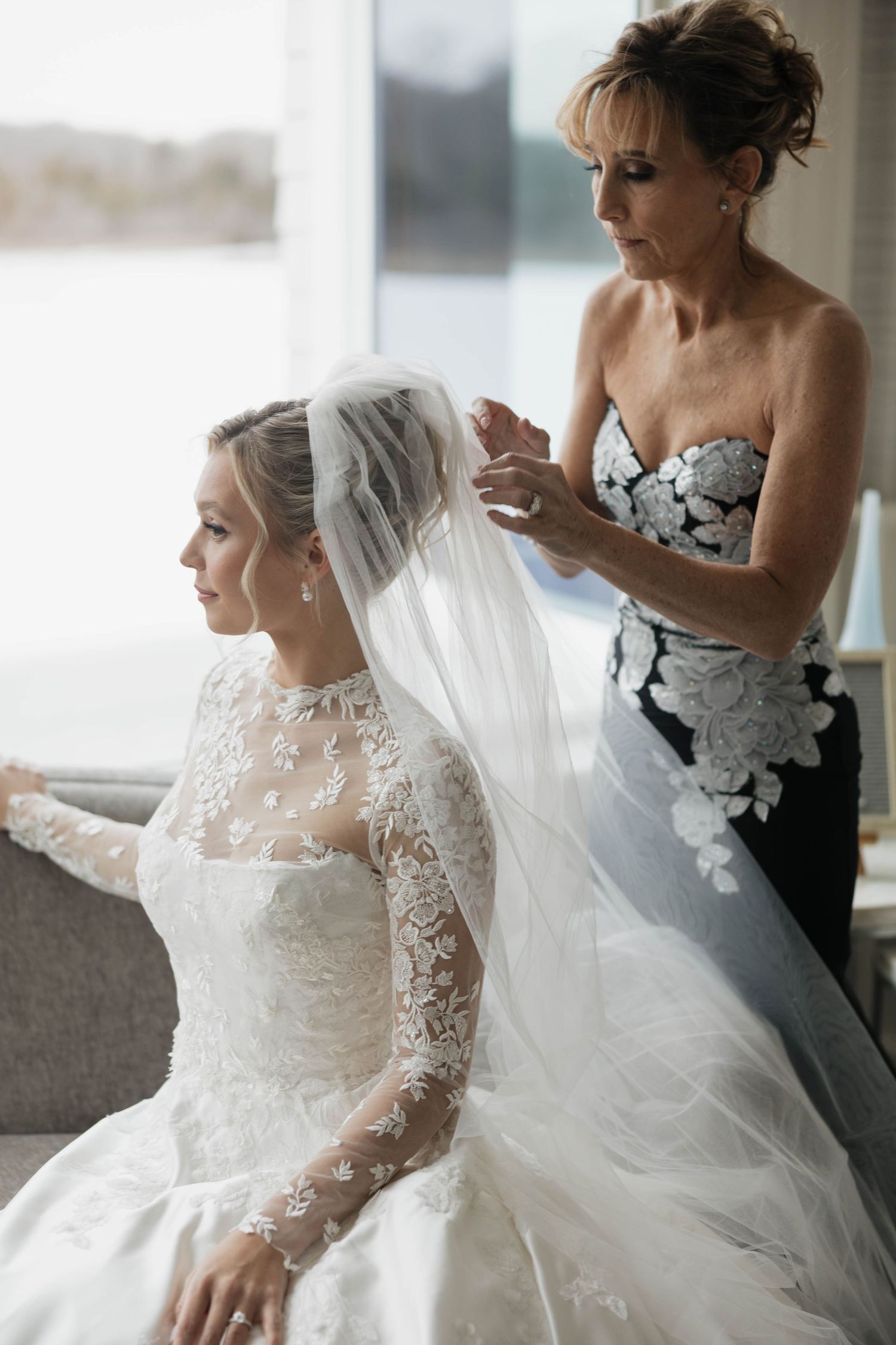 Wedding preparation scene showing detailed lace sleeves and flowing veil.